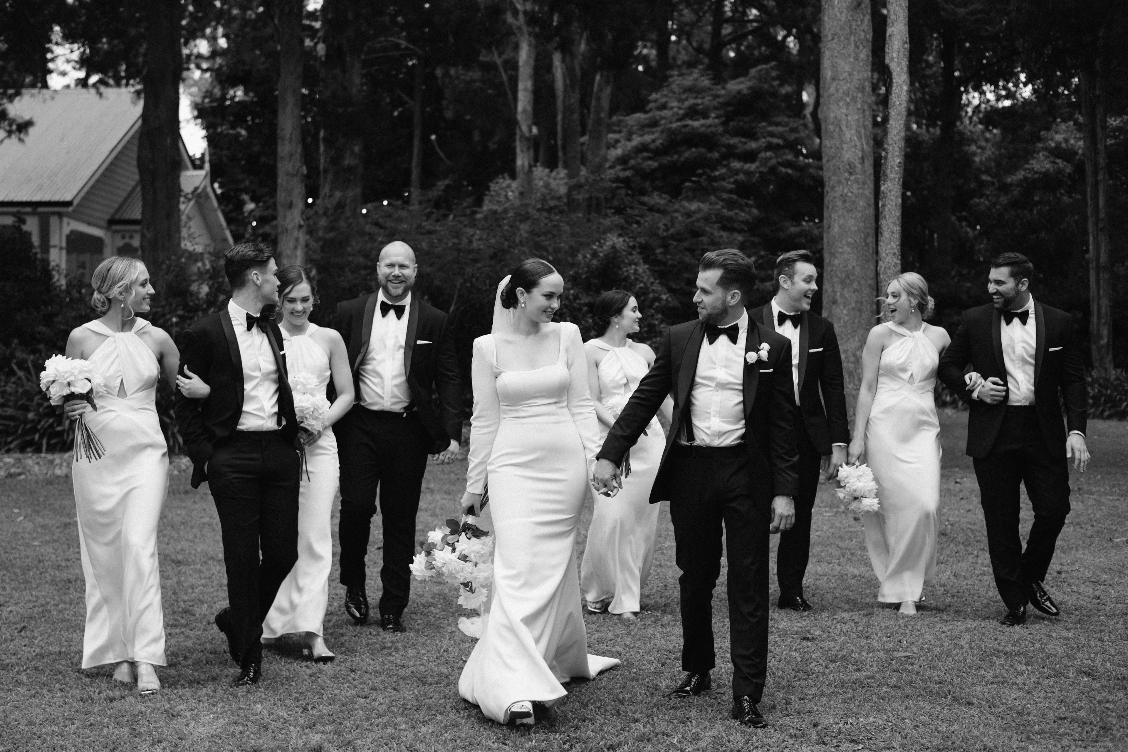 Bridal party walk in the grounds of gabbinbar