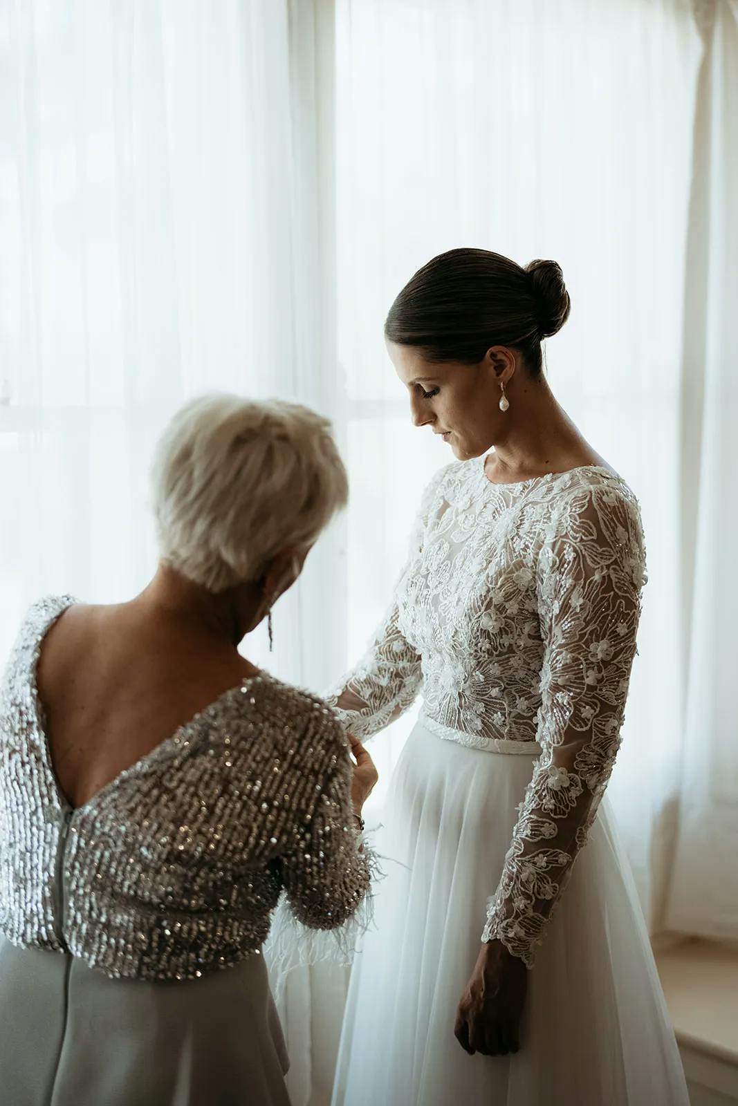 Bride and mother of the bride getting ready