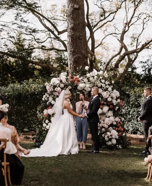 Couple marry at Gabbinbar in front of pine tree