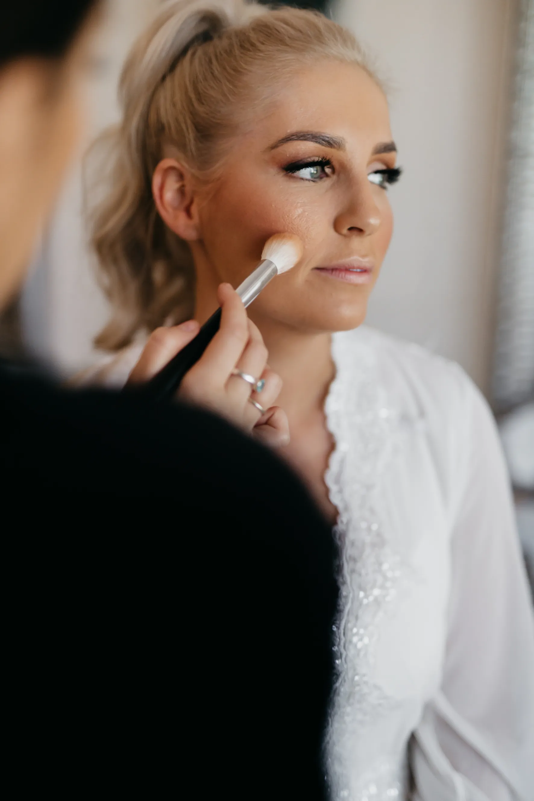 Bride getting makeup done