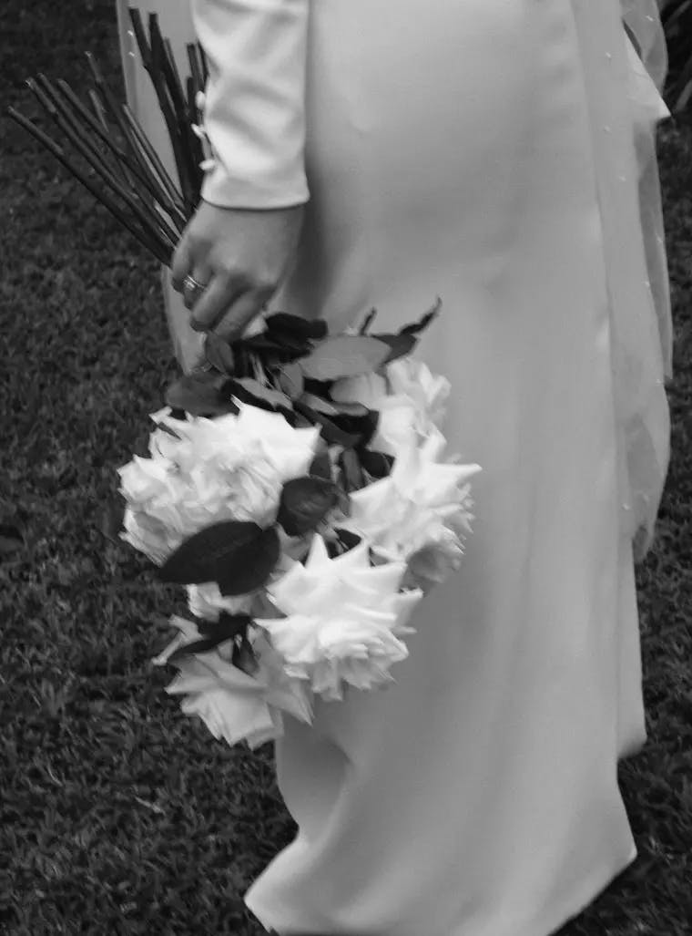 Bride walking with bouquet