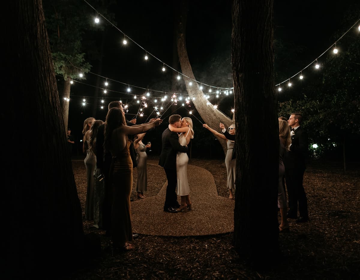 Couple dance in The Woods under festoons