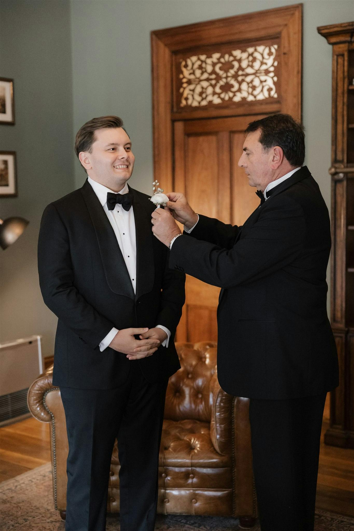 Father pinning boutonniere