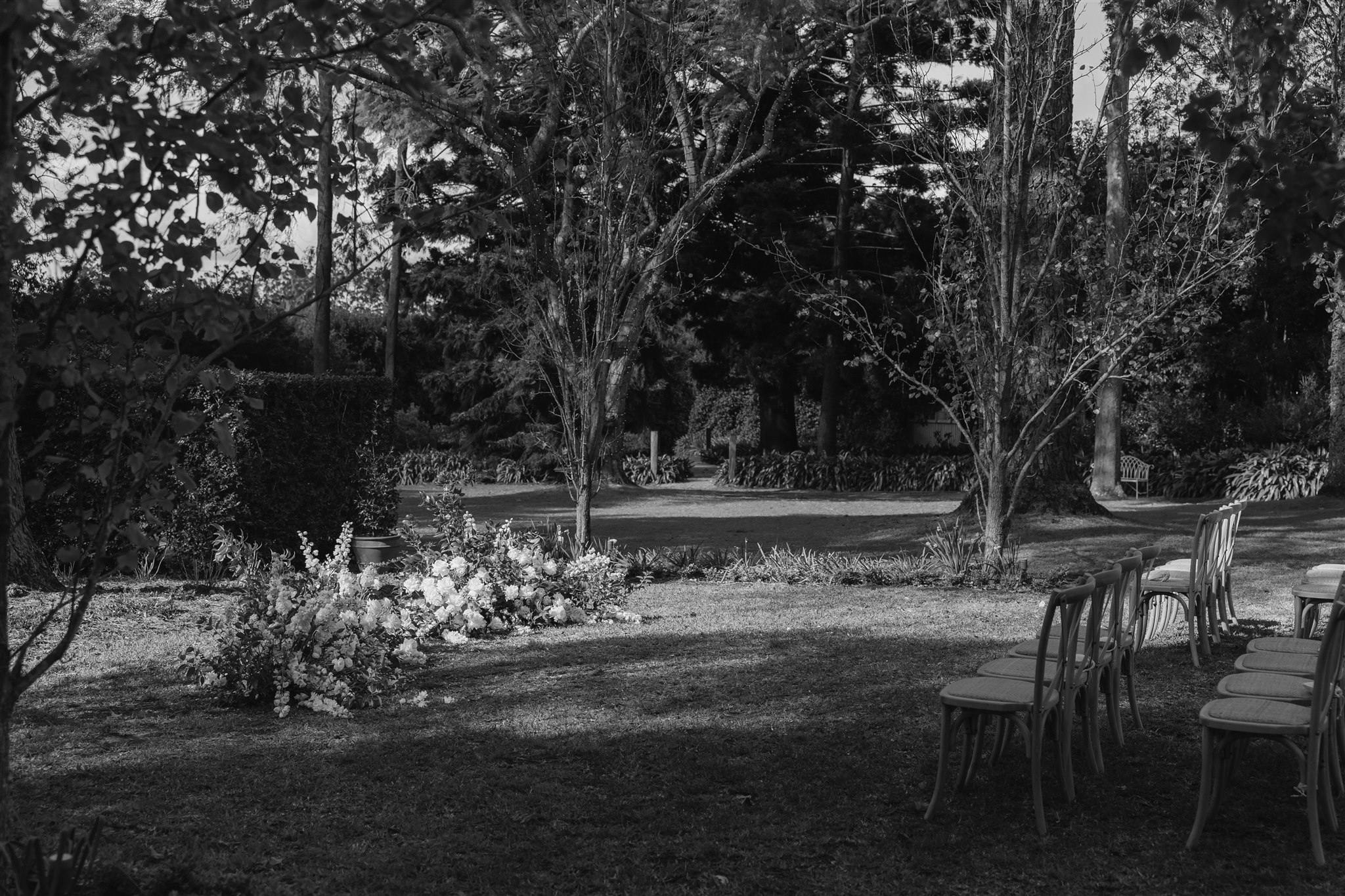 black and white photograph of an outdoor space at gabbinbar set up ready for a wedding ceremony
