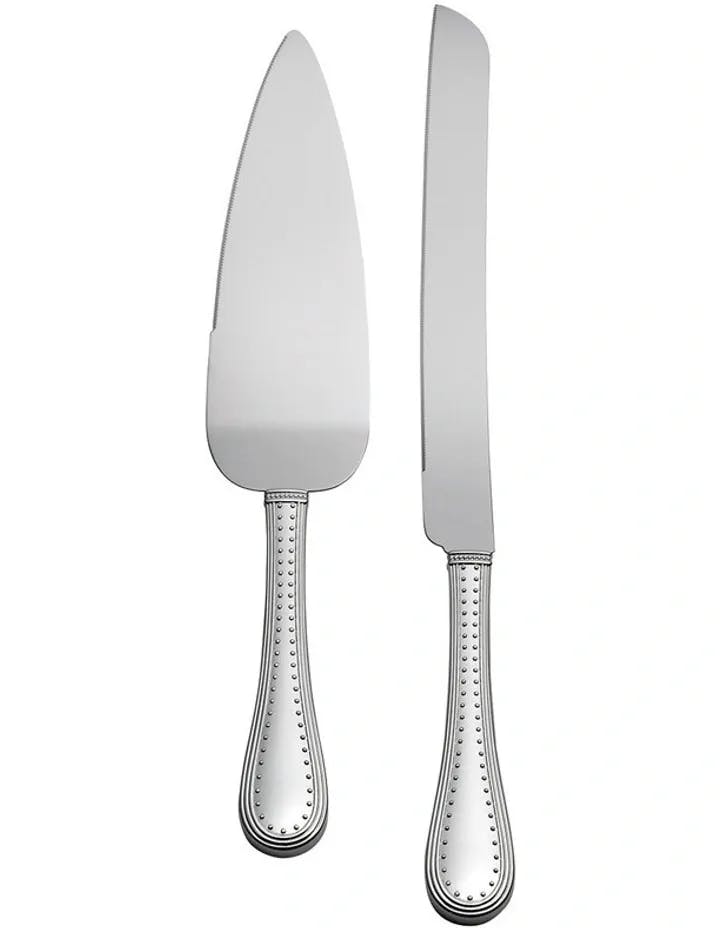 A silver cake server and cake knife with ornate handles, featuring a beaded design along the edges. The cake server has a triangular blade, while the knife has a long, straight blade. Both utensils are clean and polished.