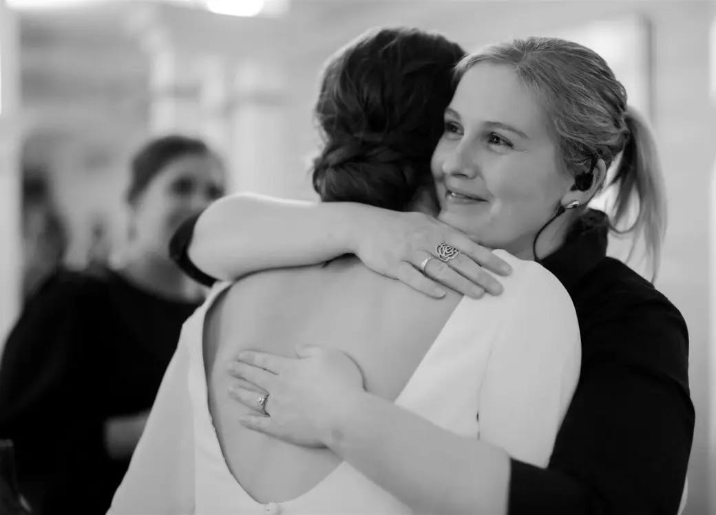 Bride hugs wedding planner