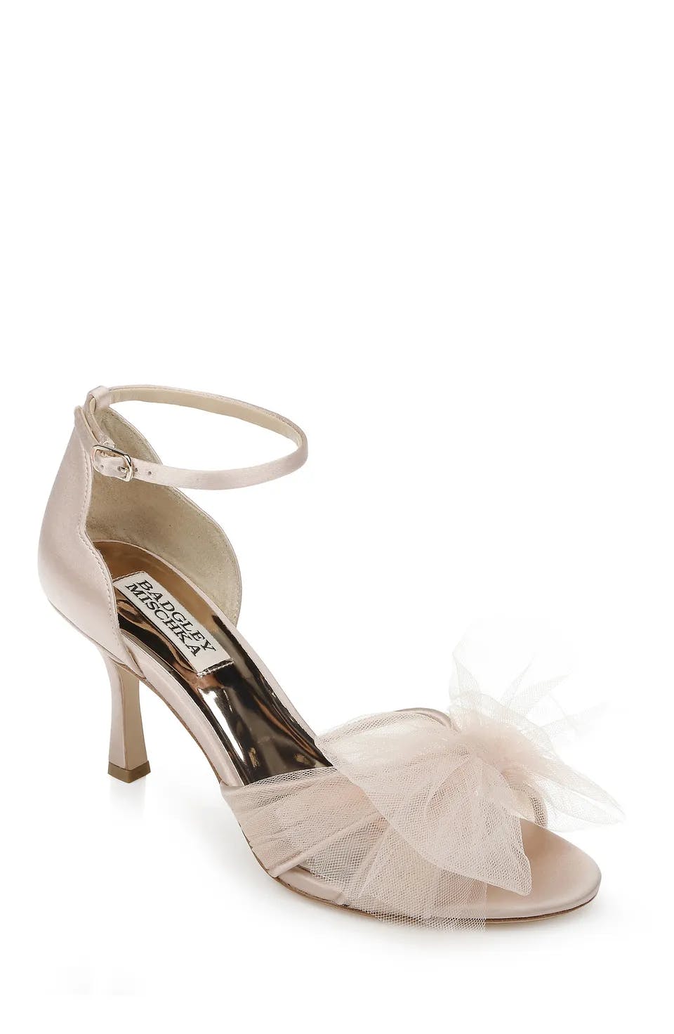 A single light pink high heel sandal with an ankle strap and a textured bow embellishment on the front. The interior sole has branding text. The heel is thin and mid-height. The design is elegant and feminine.