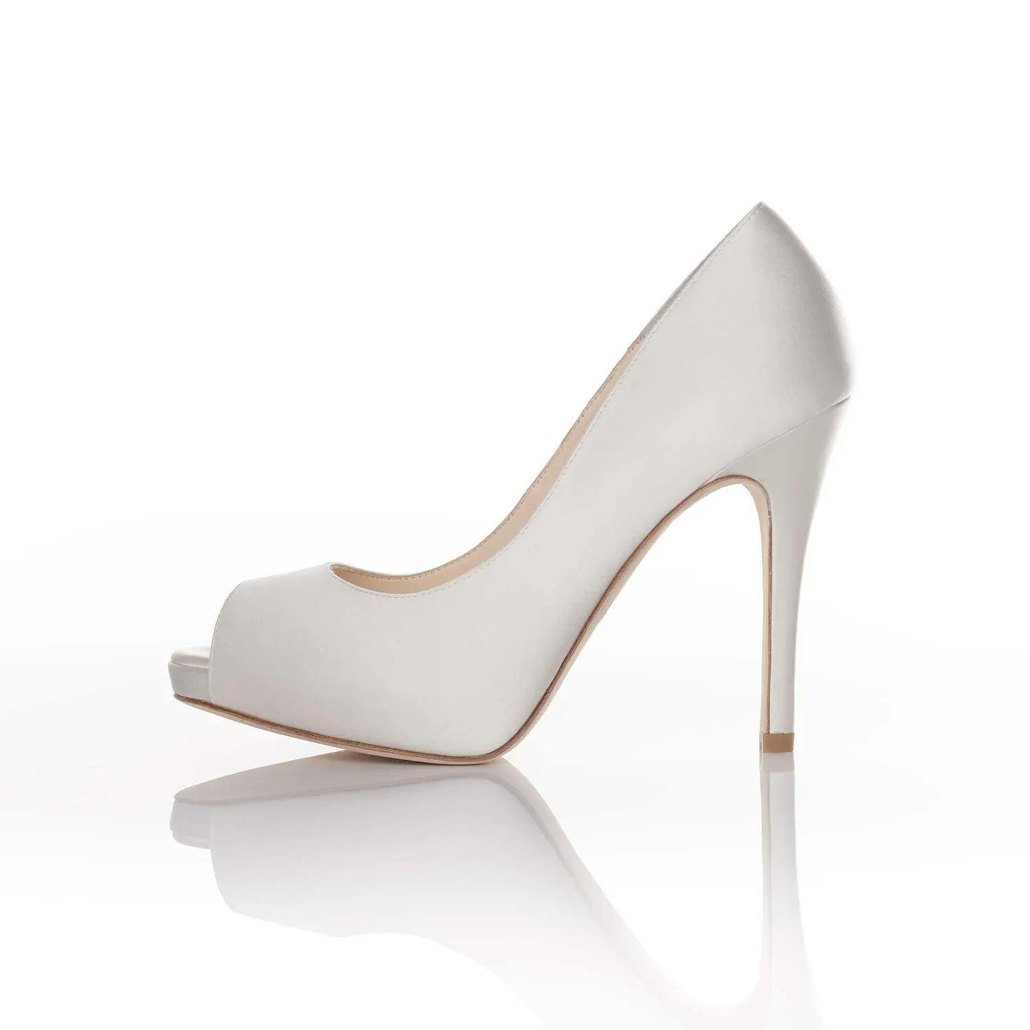 A single white high-heeled shoe with a peep-toe design, displayed on a white surface with a reflective background. The shoe has a sleek, elegant appearance with a smooth finish and a stiletto heel.