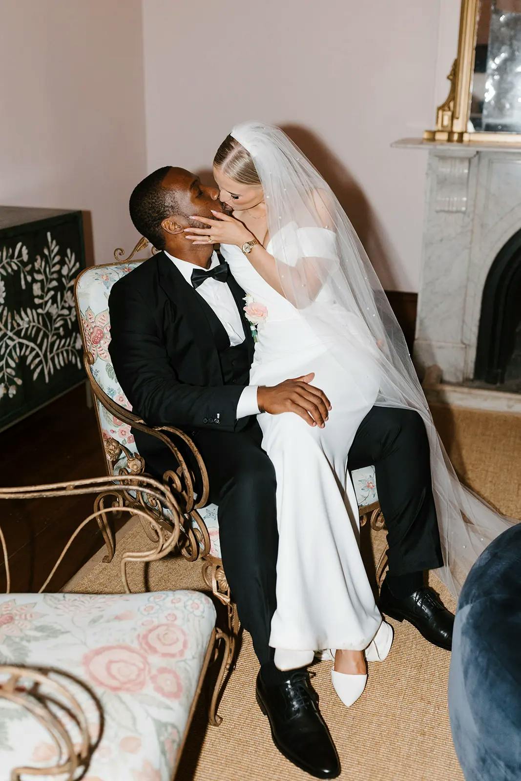 Couple kiss on wedding chair