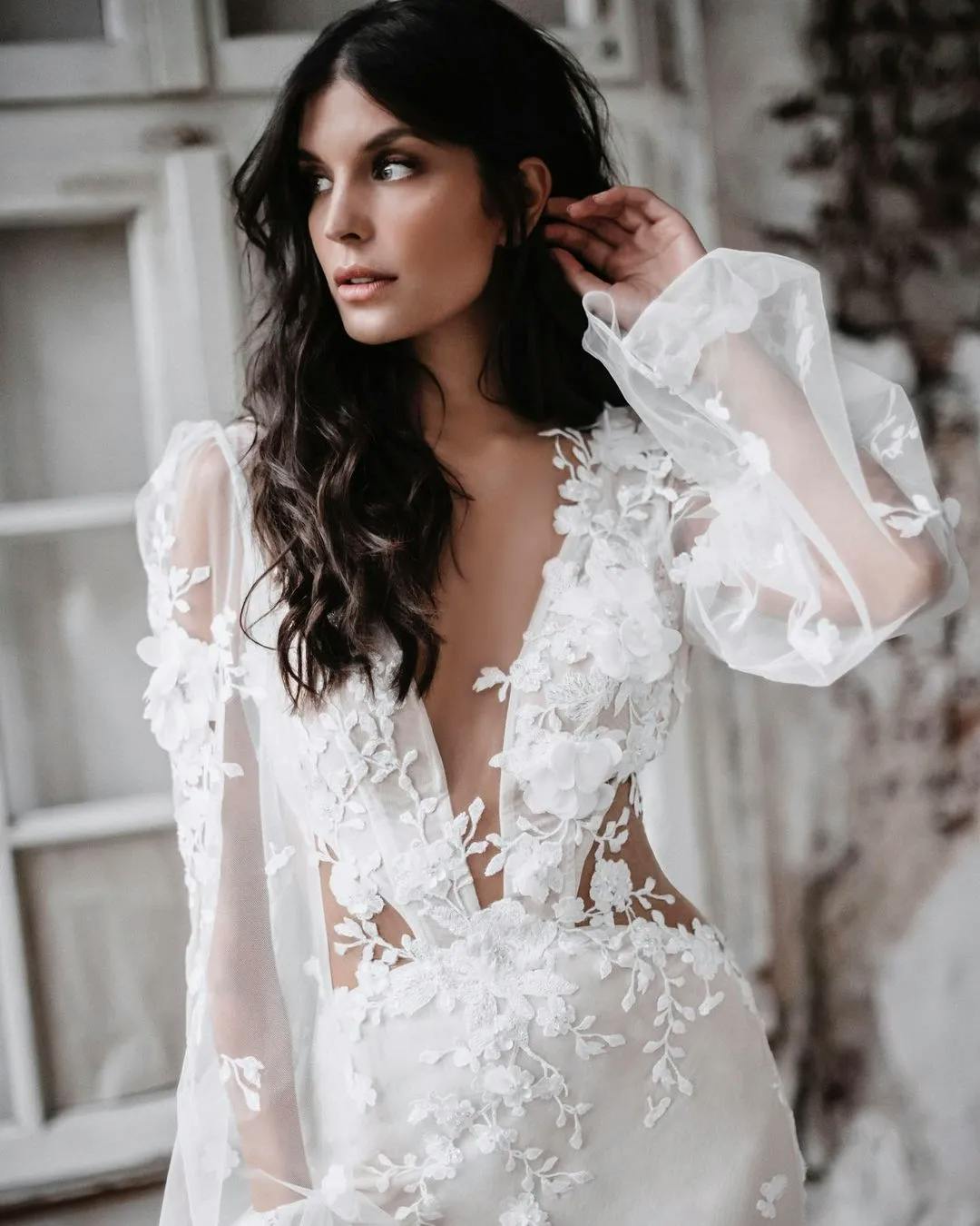Bride with wedding dress with long sleeves