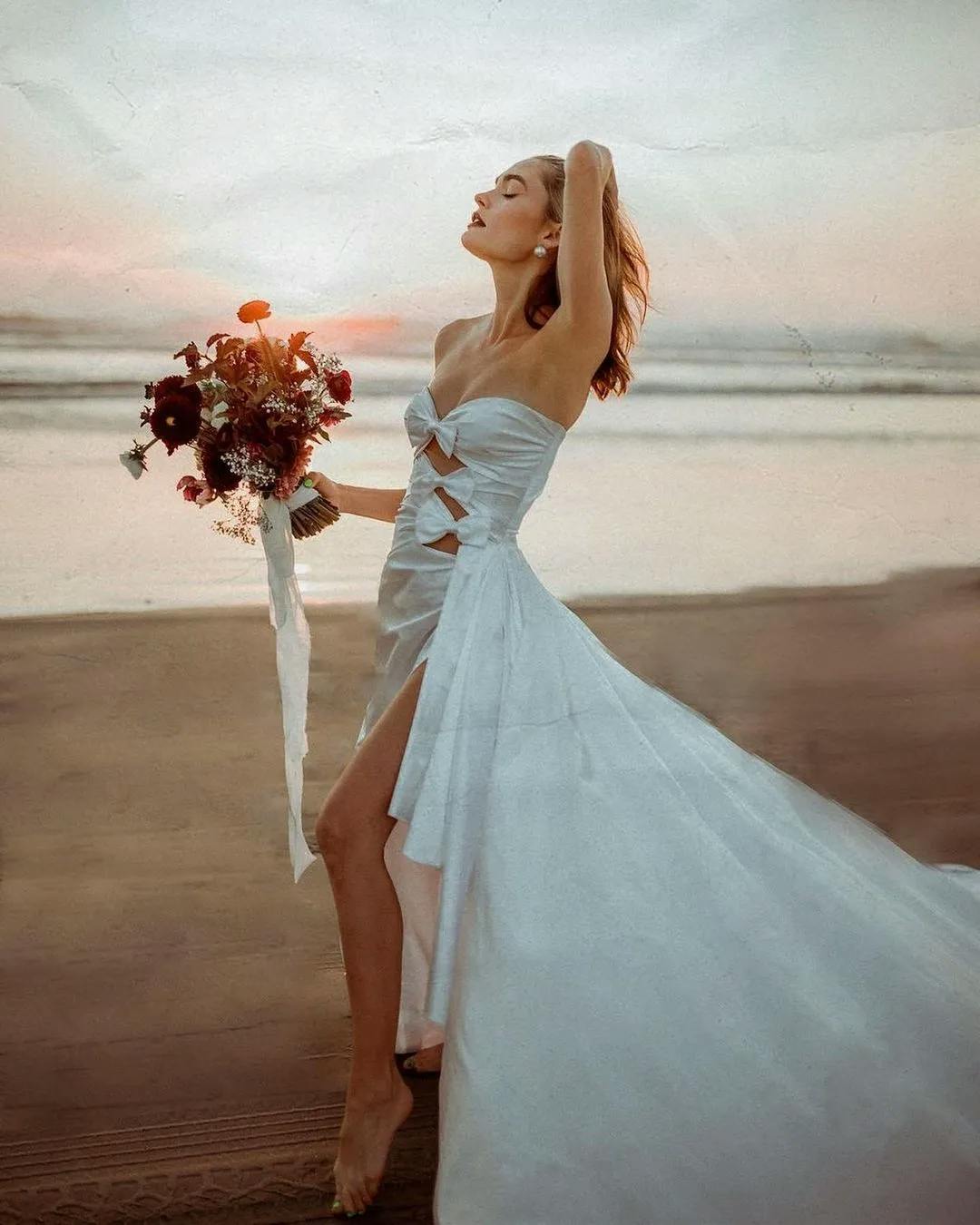 Bride wearing gown wiht cutouts