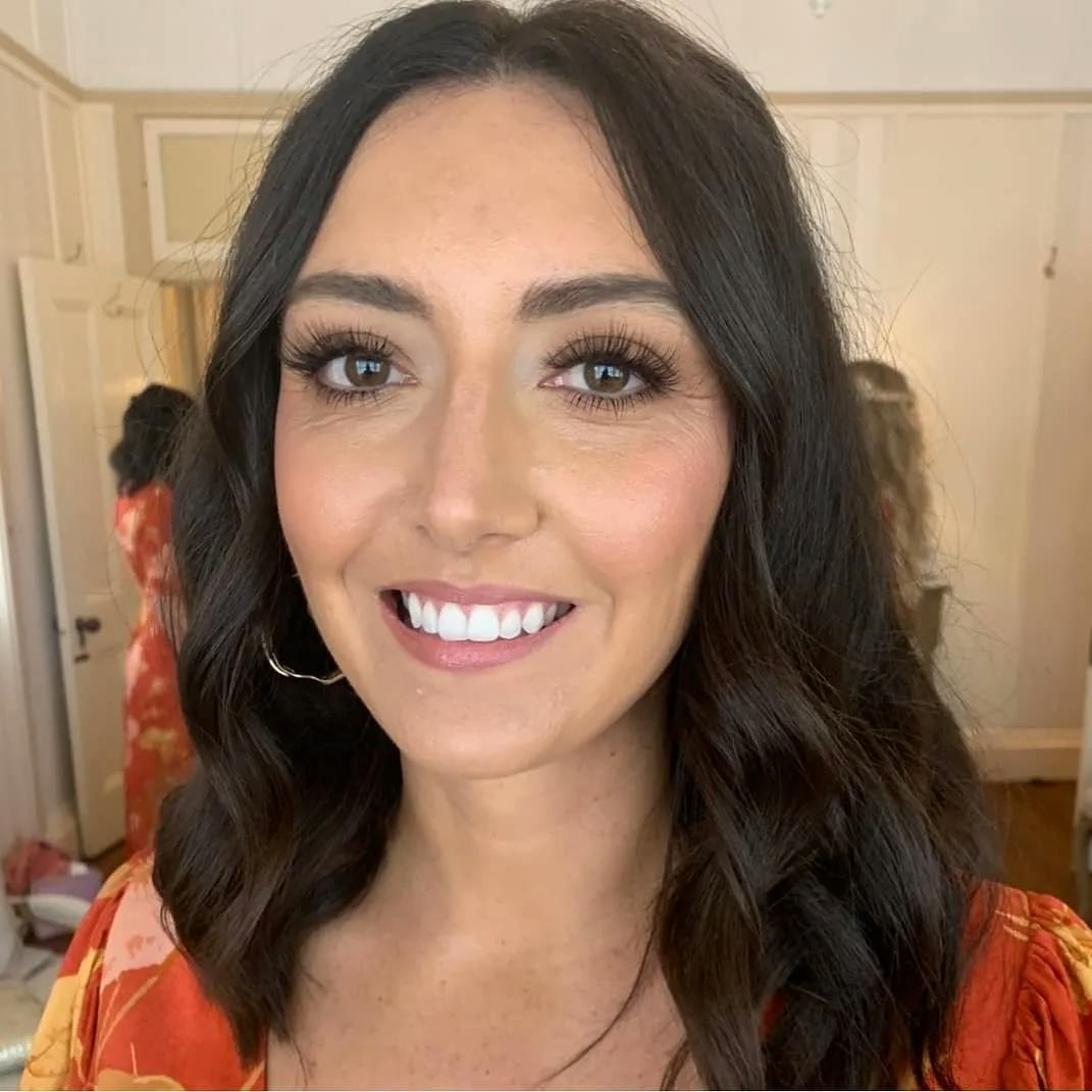 Bridesmaid smiling with makeup on
