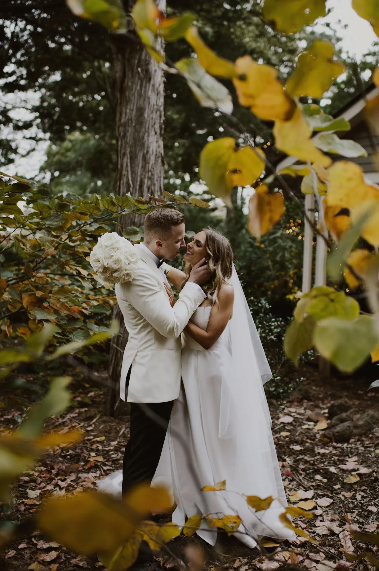 a happy couple enjoying a private moment in the woods surrounding the gabbinbar wedding venue