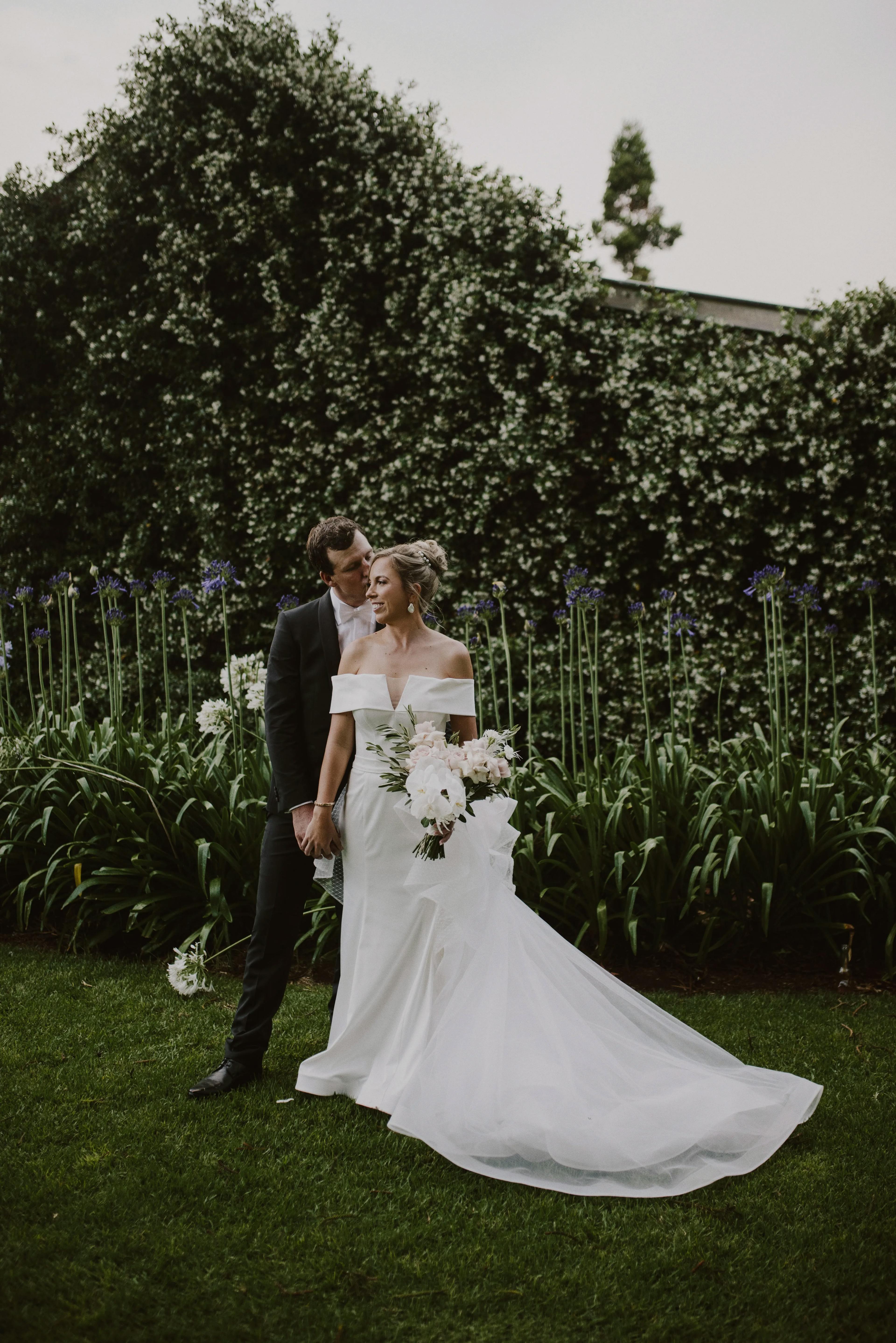Bride and groom in gardens