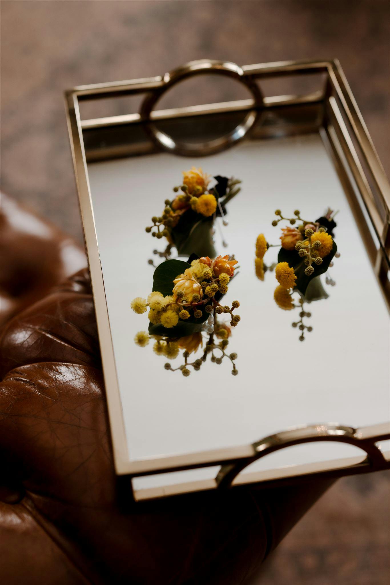 Boutonniere on gold tray