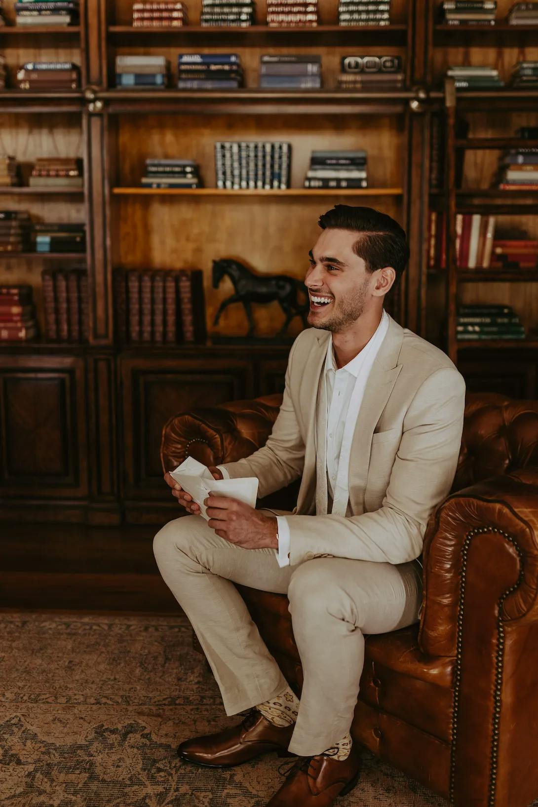 Groom reading letter from bride