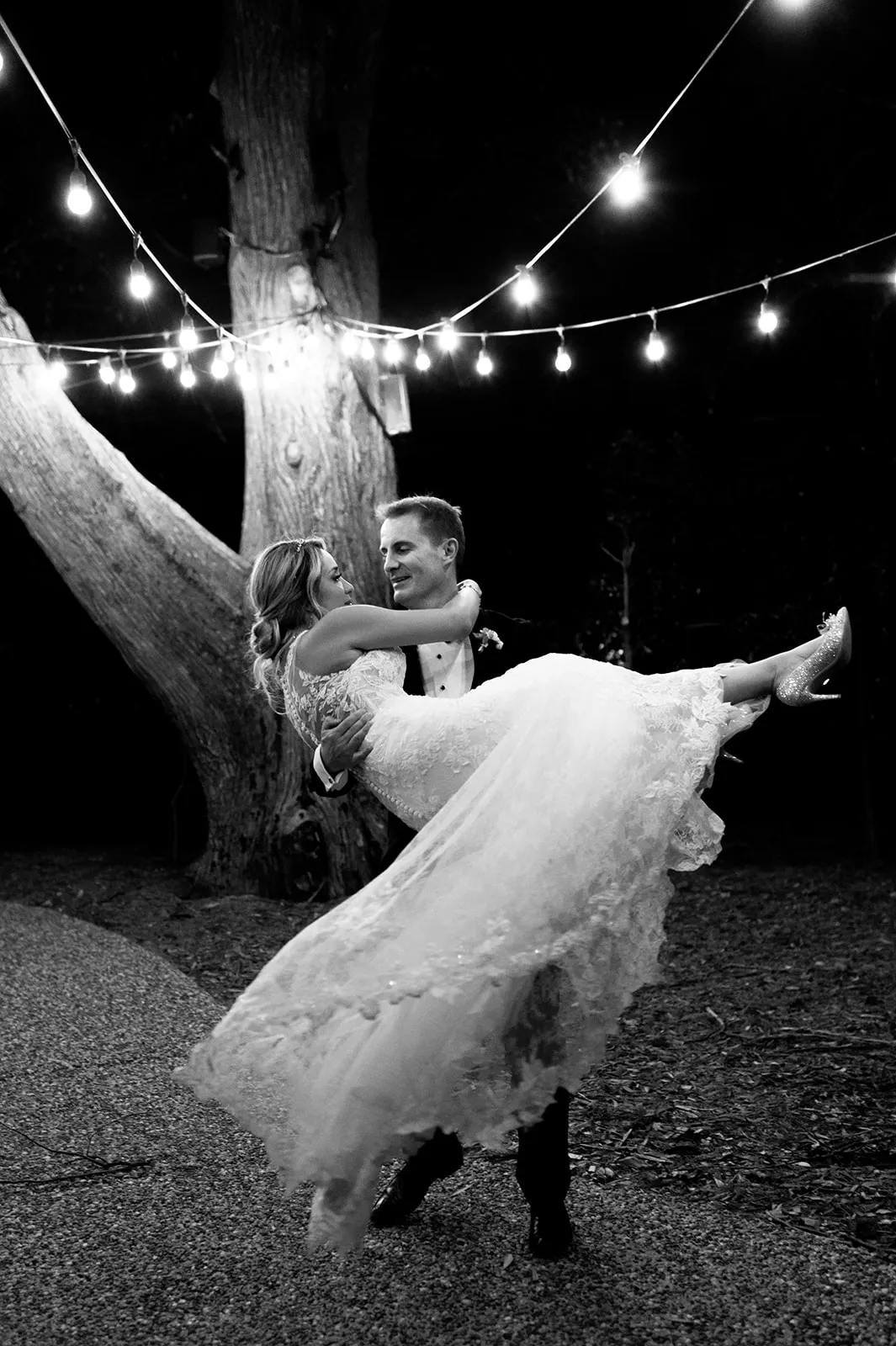 Bride and groomd dancing at night