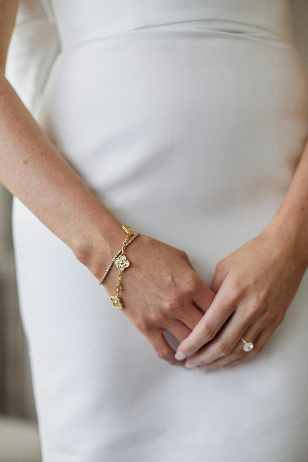 Bride wearing bracelet and wedding ring