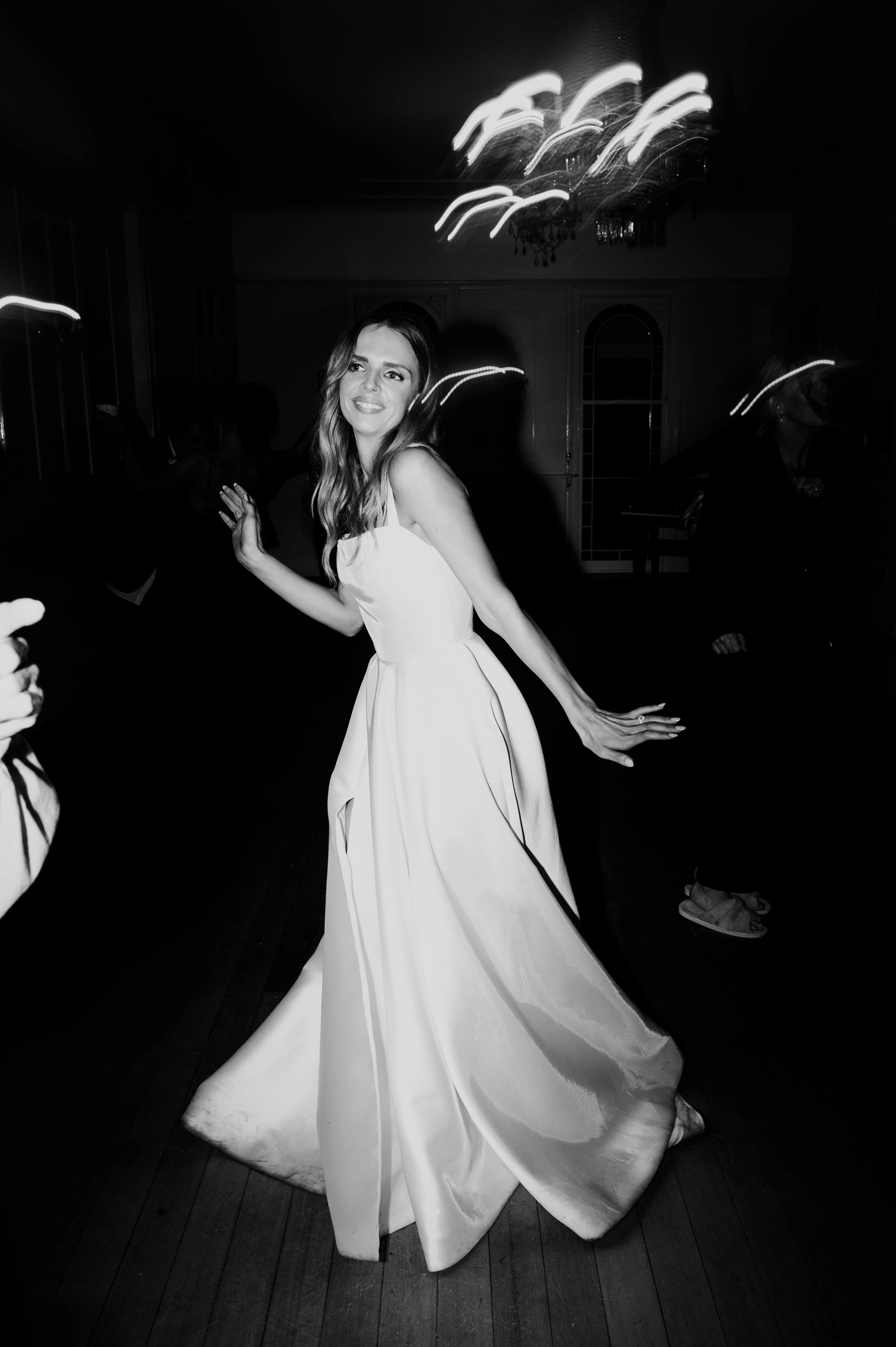 Bride dances in black and white