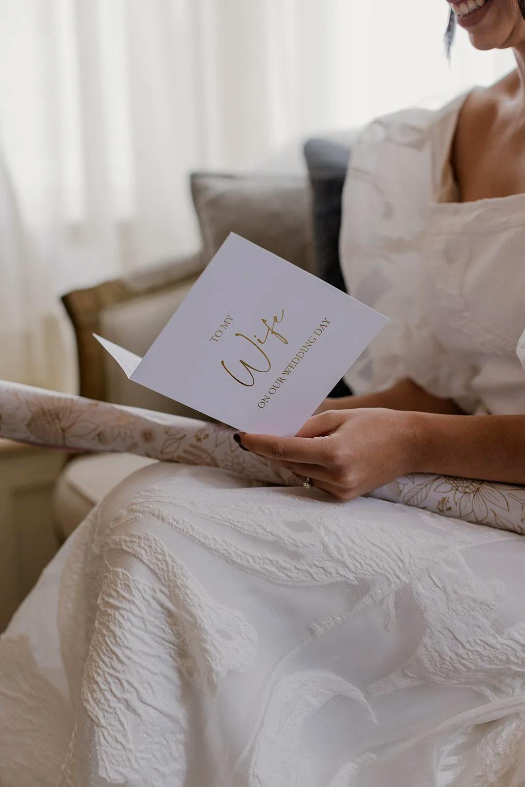 Bride reading card from husband