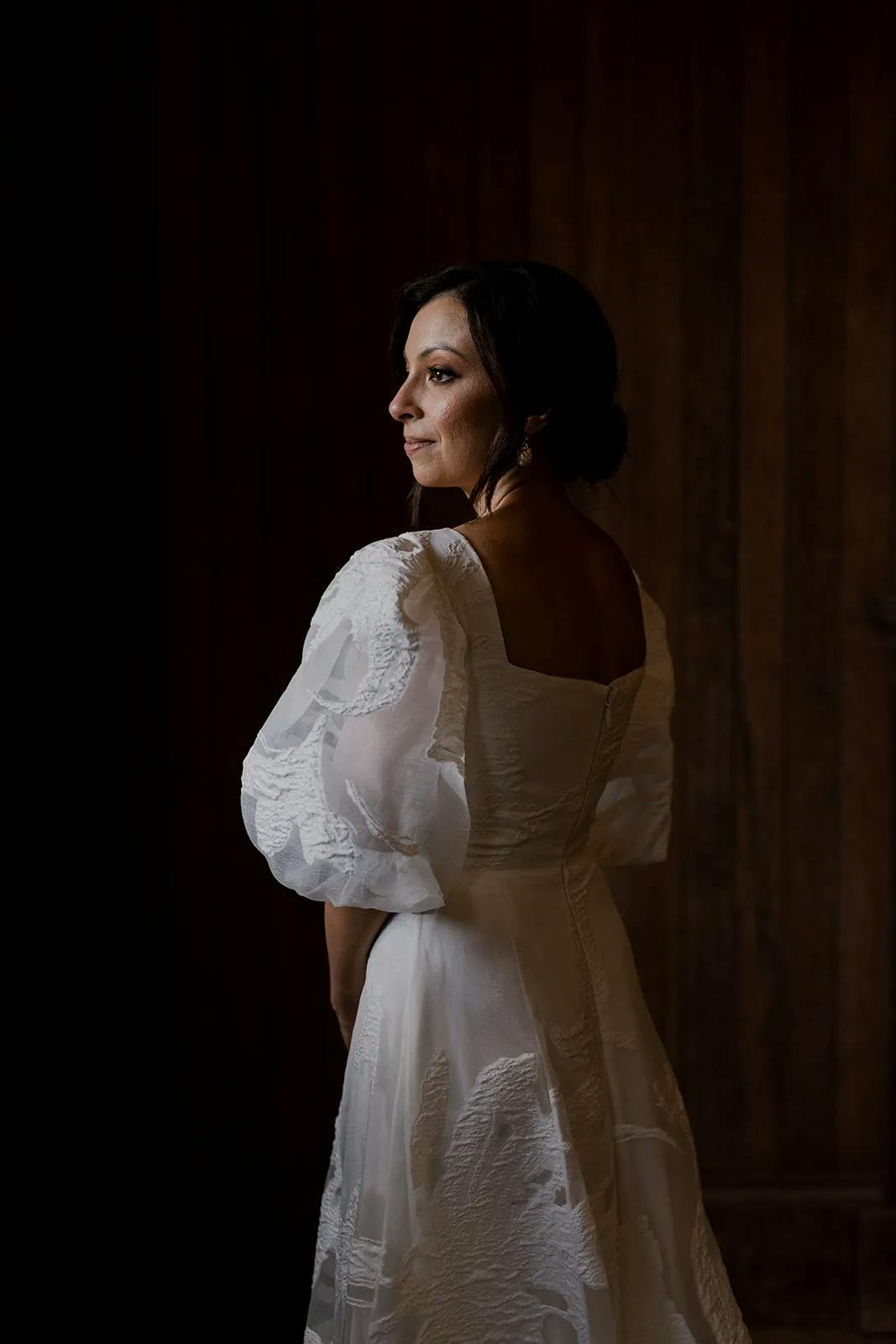 Bride wearing a dress with billowy sleeves