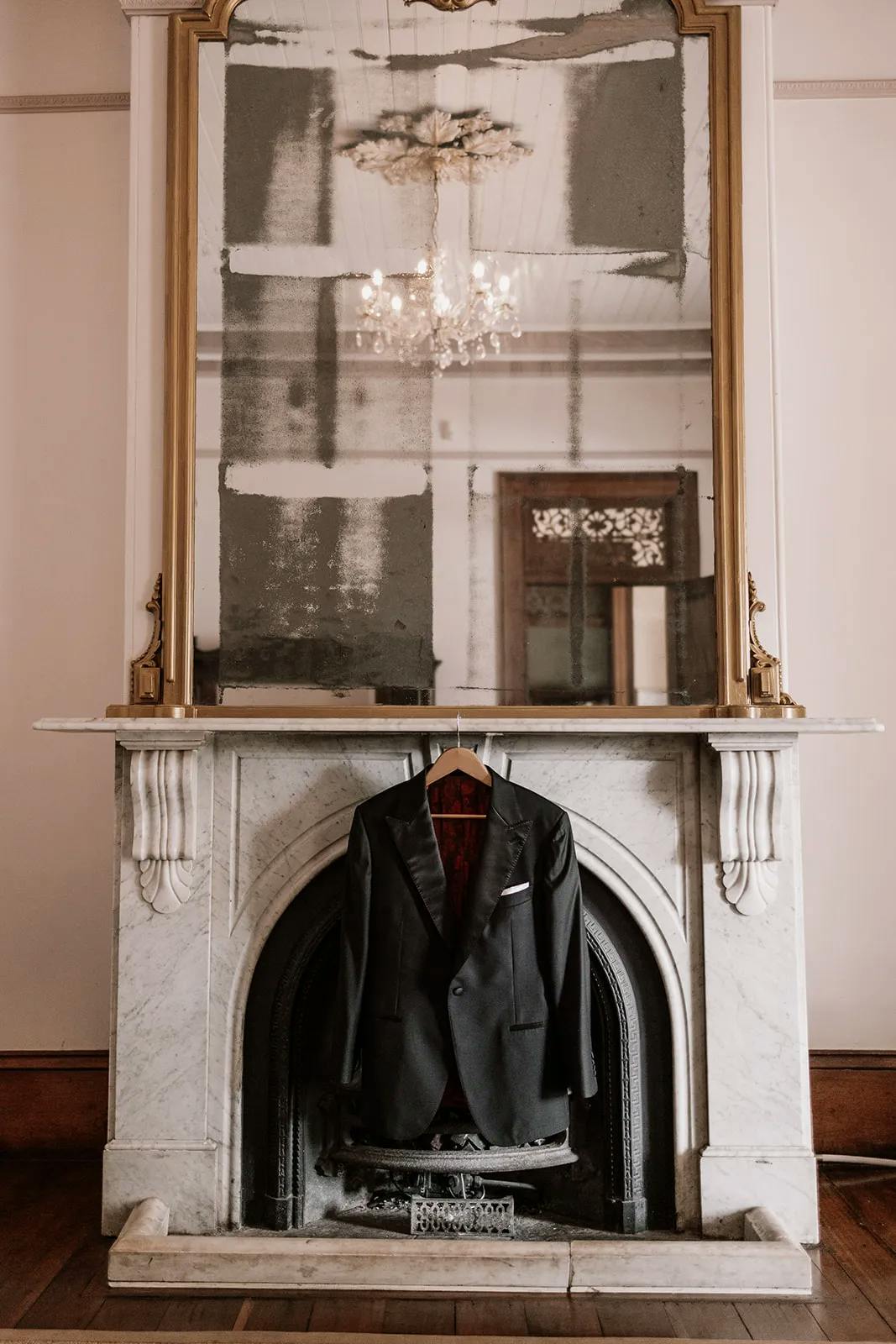Fireplace with suit jacket hanging in front
