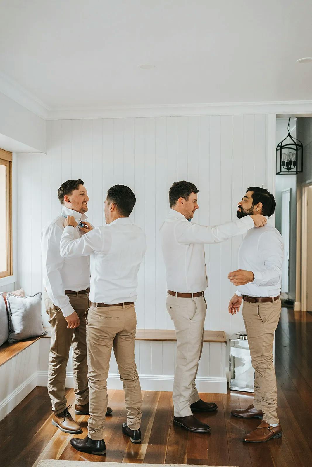 Groom and groomsment getting ready