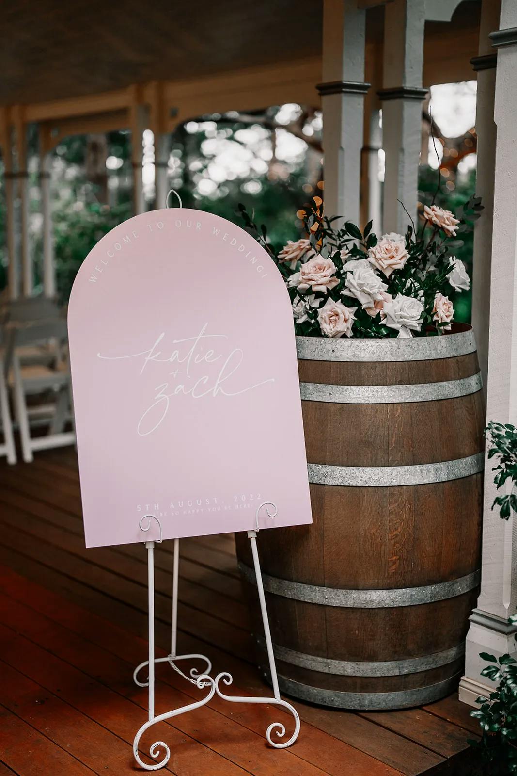 Welcome sign with wine barrel and flowers