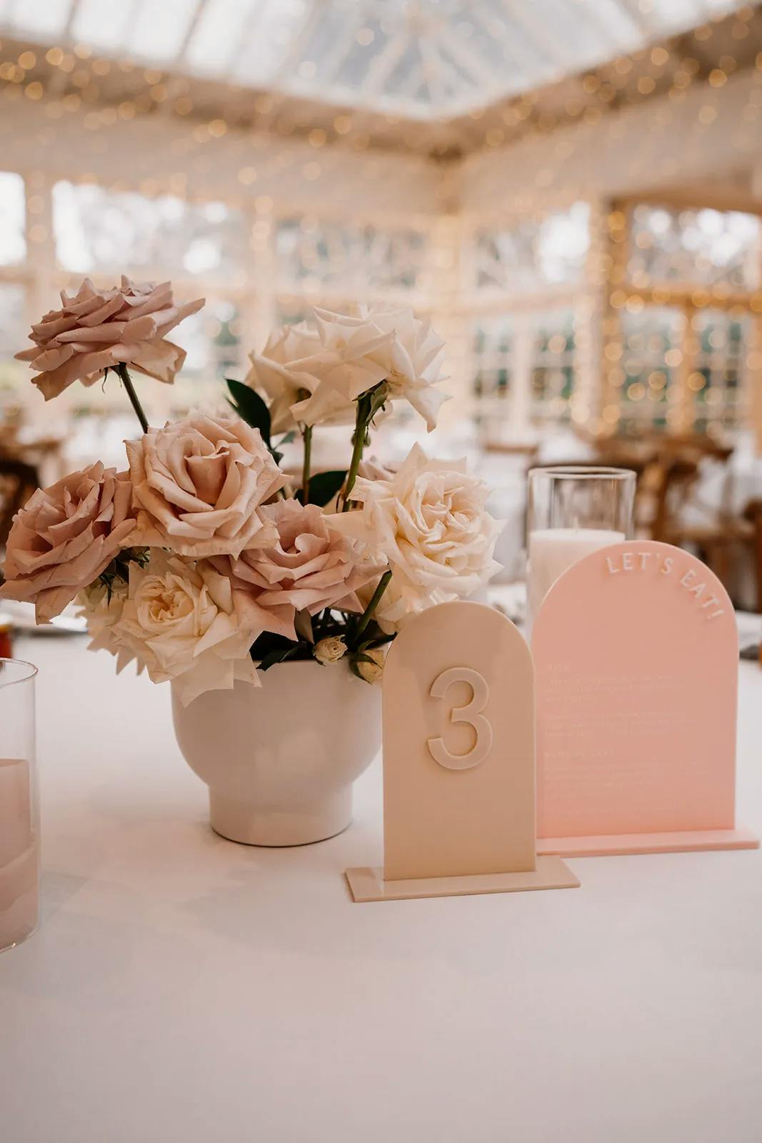 Wedding table setting with flowers and place cards