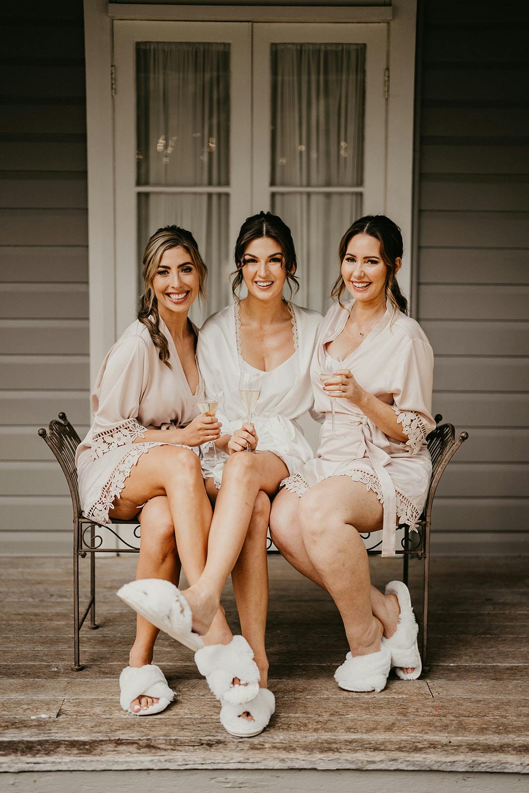 Bride and bridesmaids sitting together