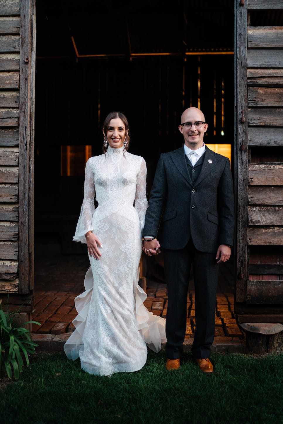 Bride and groom standing in doorway