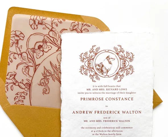 A wedding invitation set featuring a gold envelope with a floral inner lining and an invitation card. The card has a decorative border at the top with an illustration of a bird, and it contains text inviting guests to the wedding of Primrose Constance to Andrew Frederick Walton.