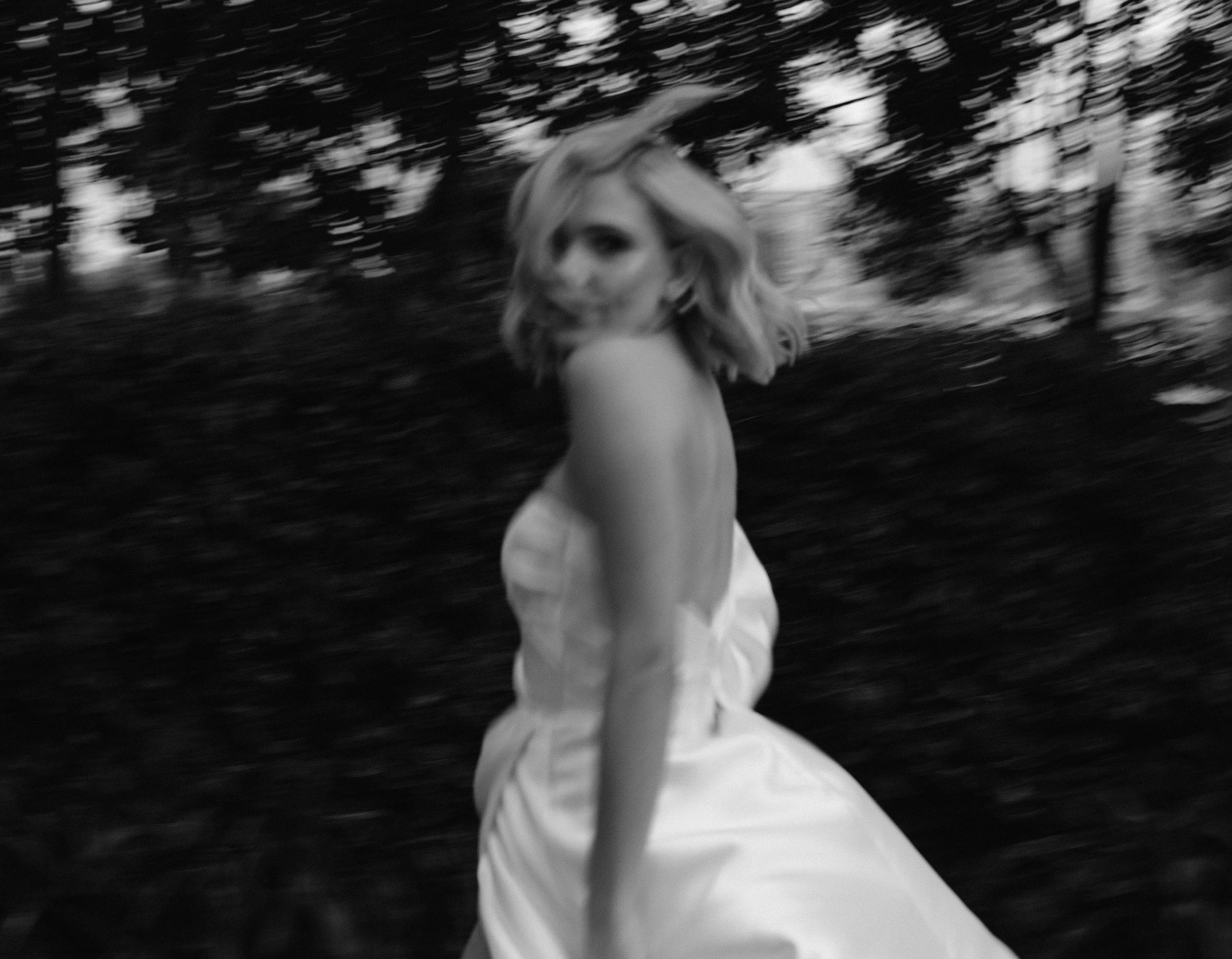 Bride runs in black and white