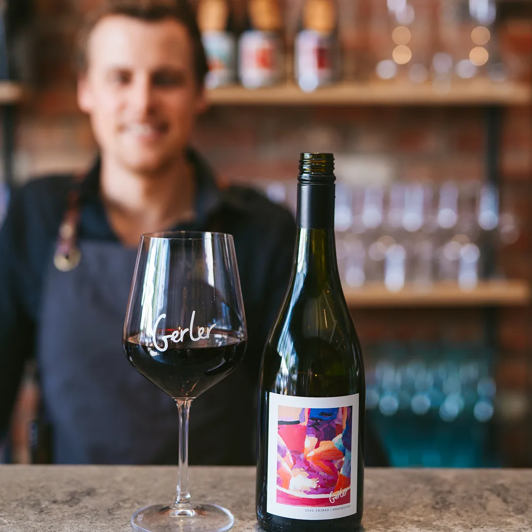 Red wine bottle with wine glass