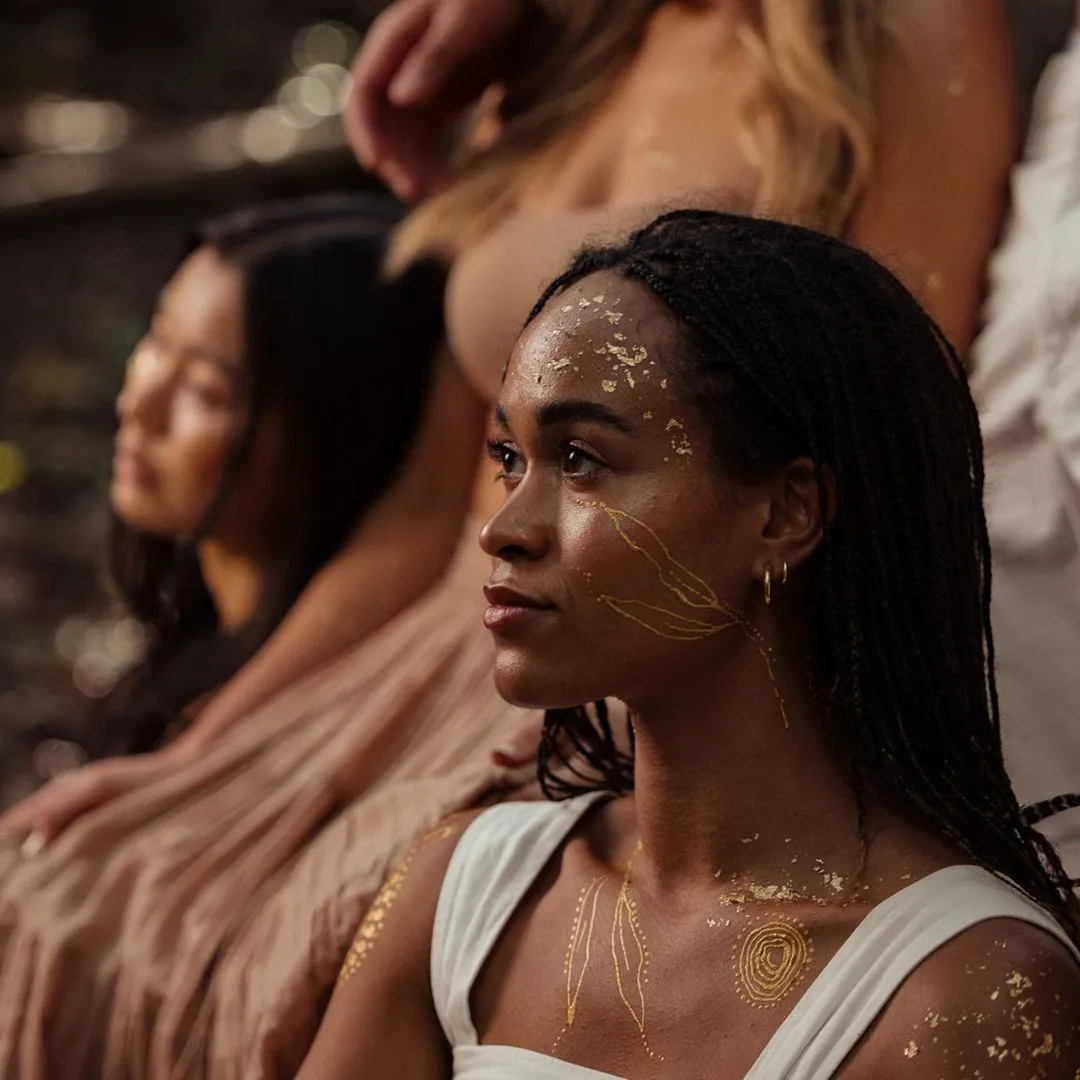 Girl with gold paint on her