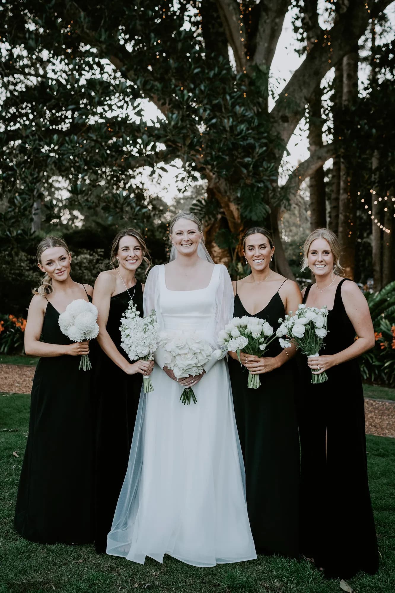 Bride and bridesmaid holding bouquet