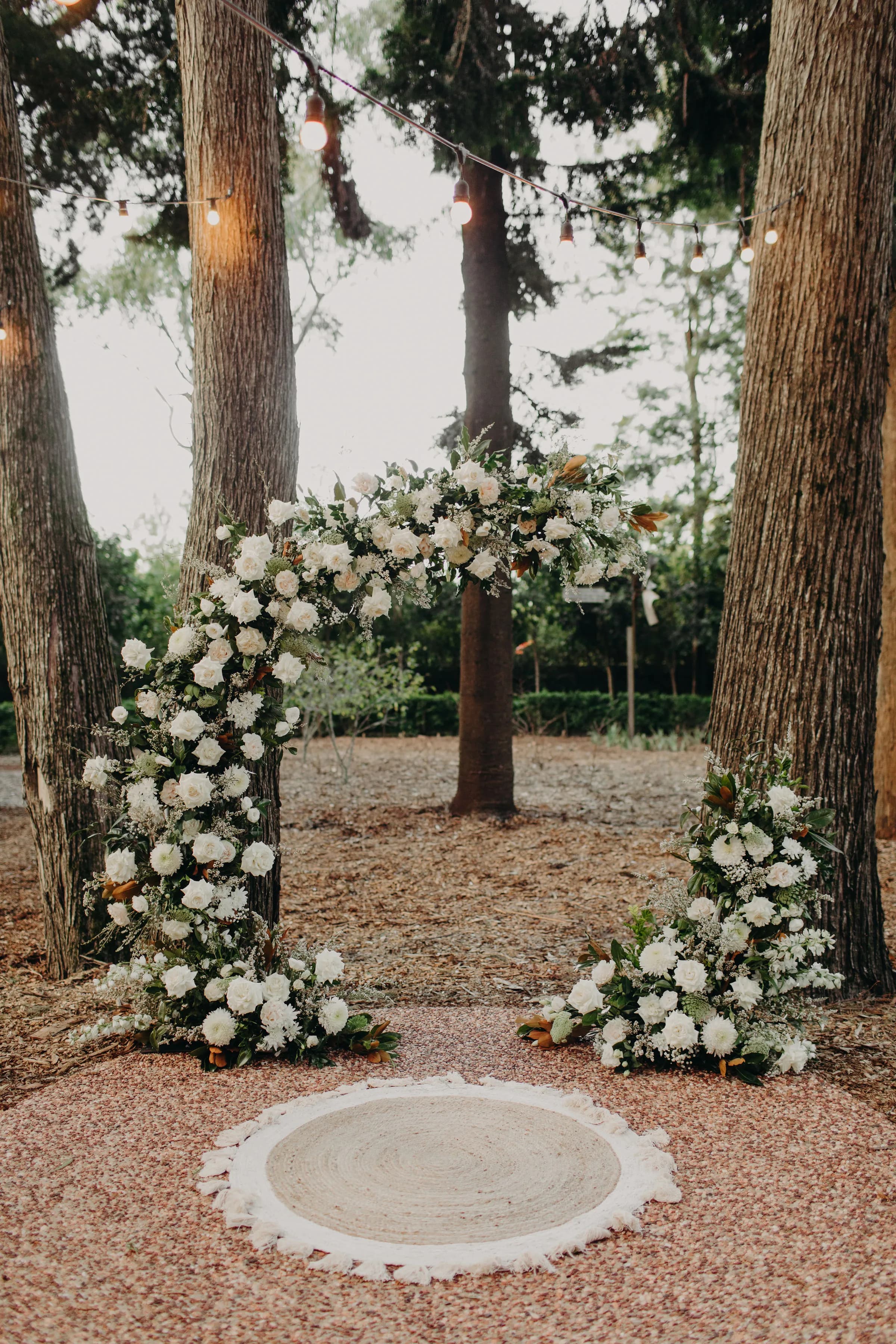 Semi-circular arbour with white roses