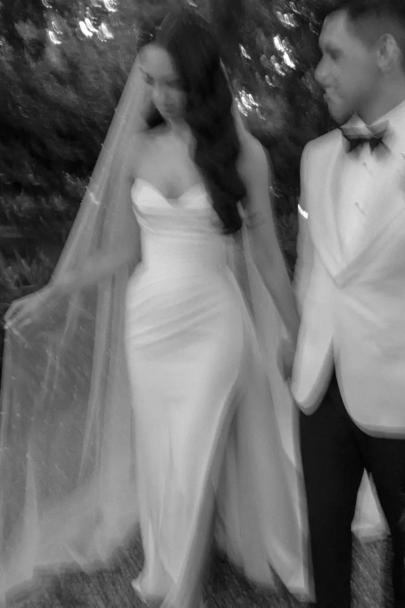 couple walking in black and white