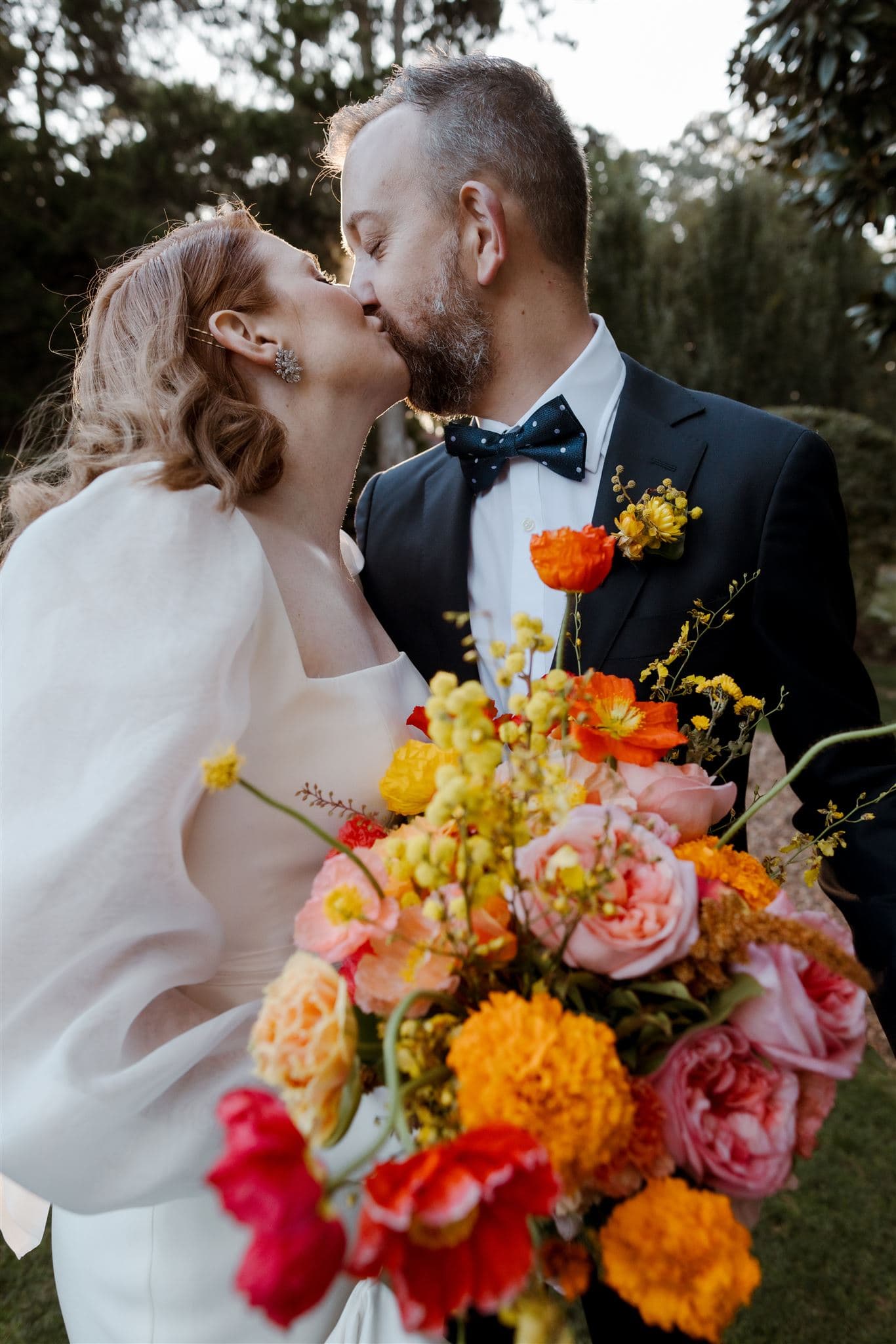 Bride and groom kissing