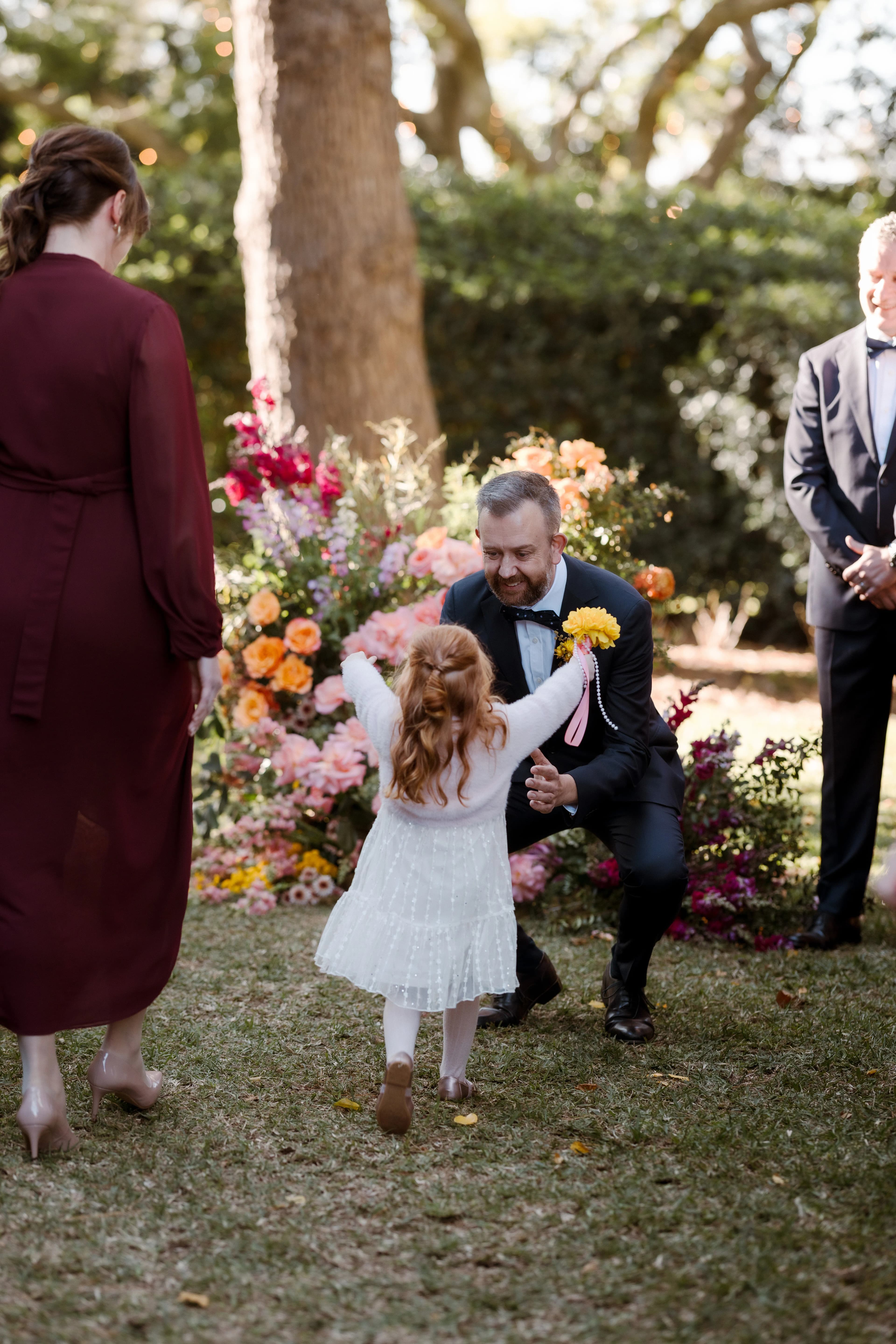 groom and daughter embrace