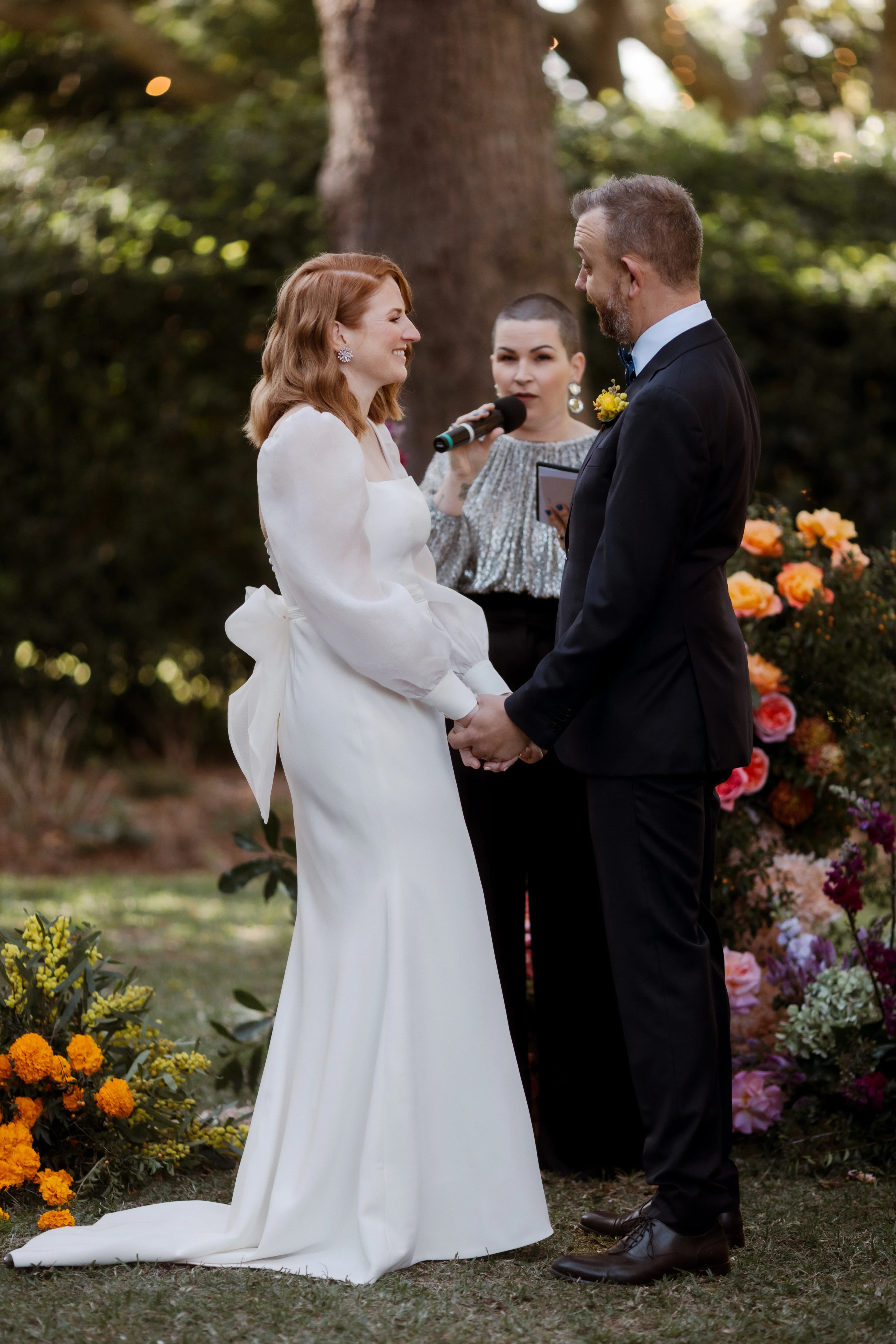 Bride and groom holding hands
