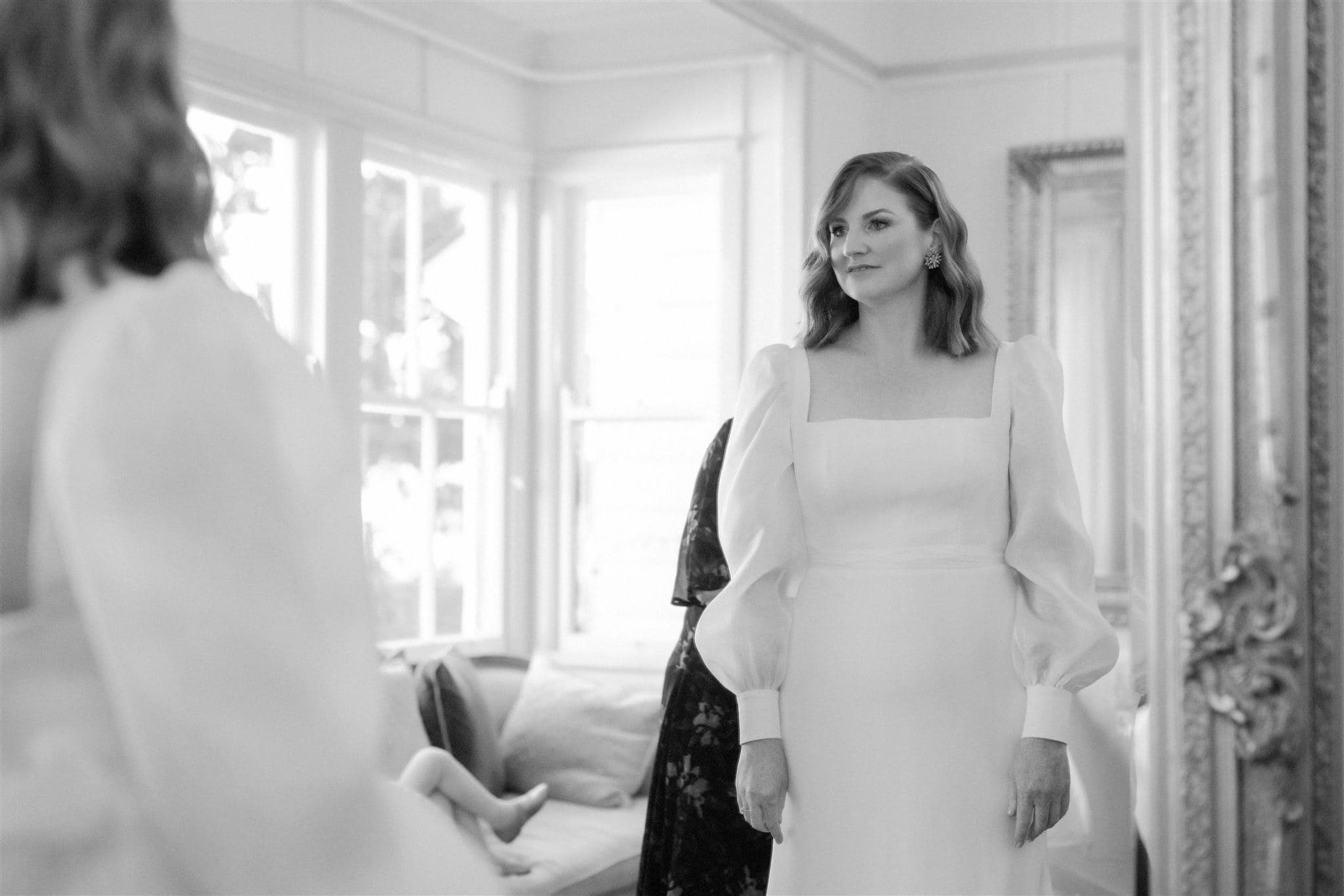 Bride looking in mirror