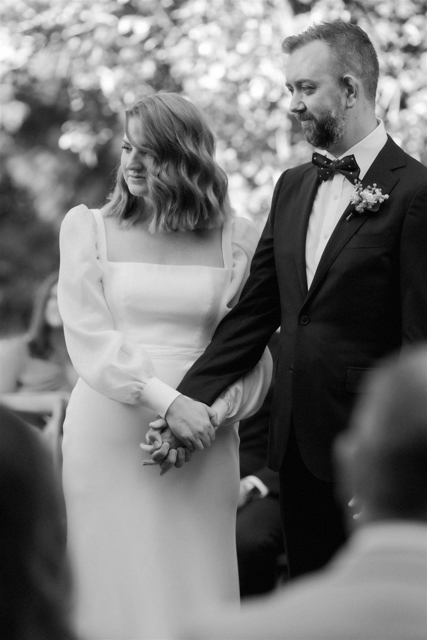 Bride and groom holding hands