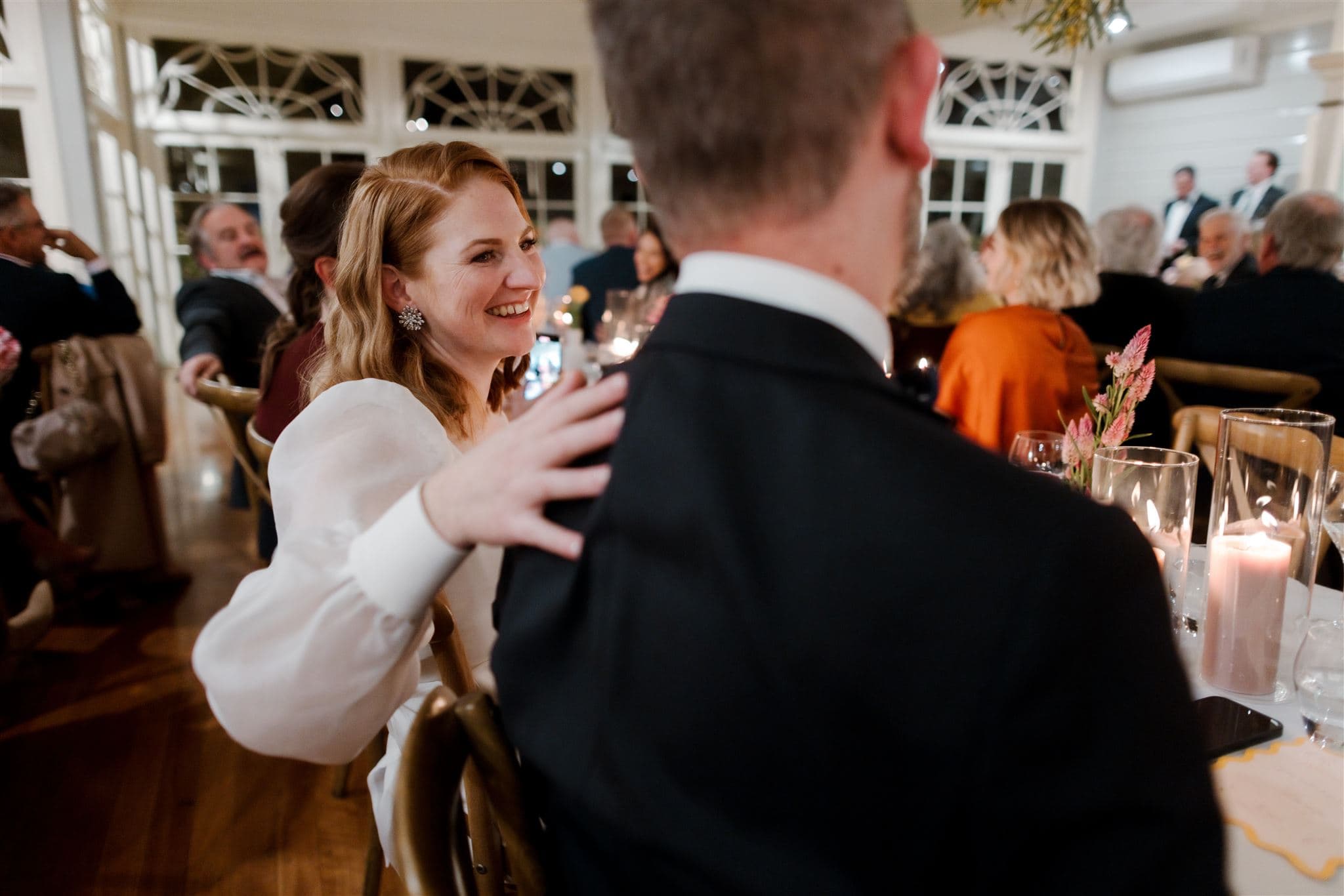 Bride and groom sitting in reception