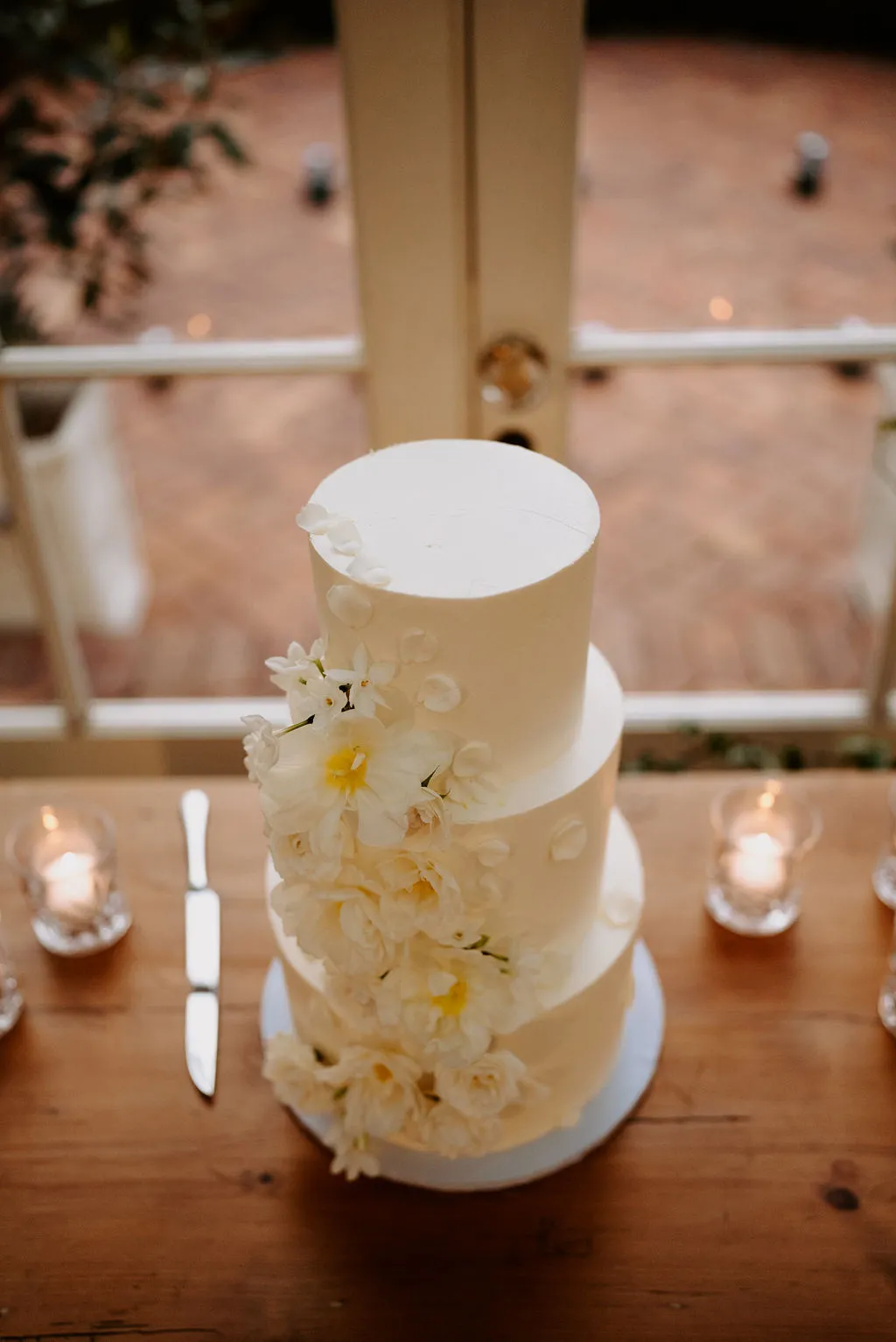 Wedding cake with yellow flowers