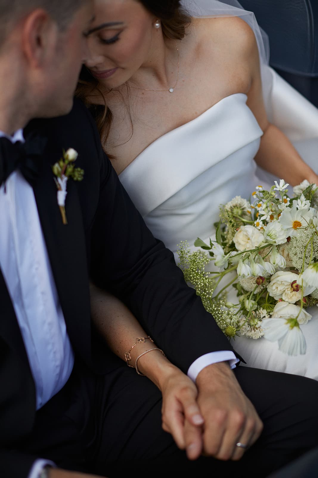 Bride and groom holding hands