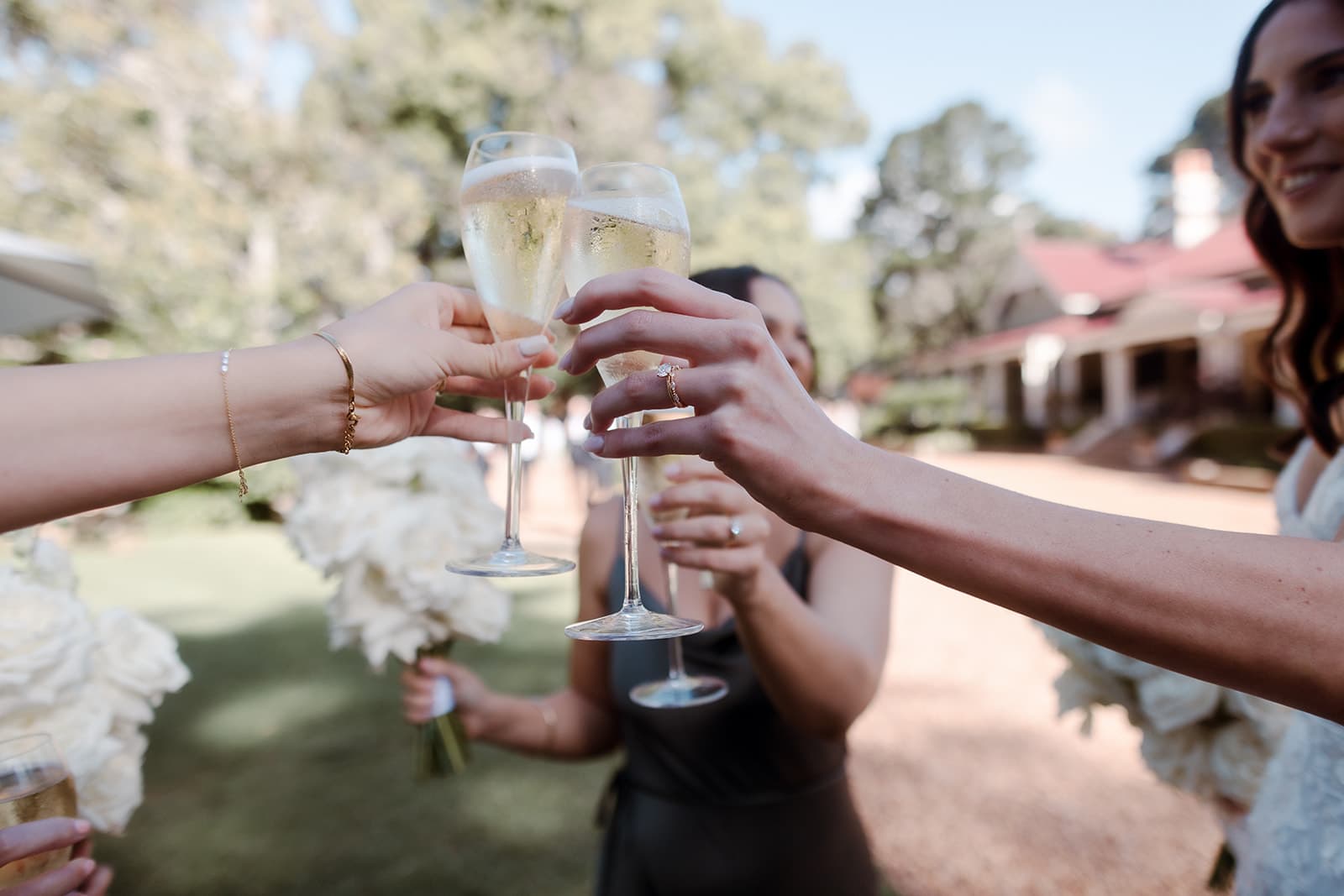 Brdie and bridesmaids drinking champagne