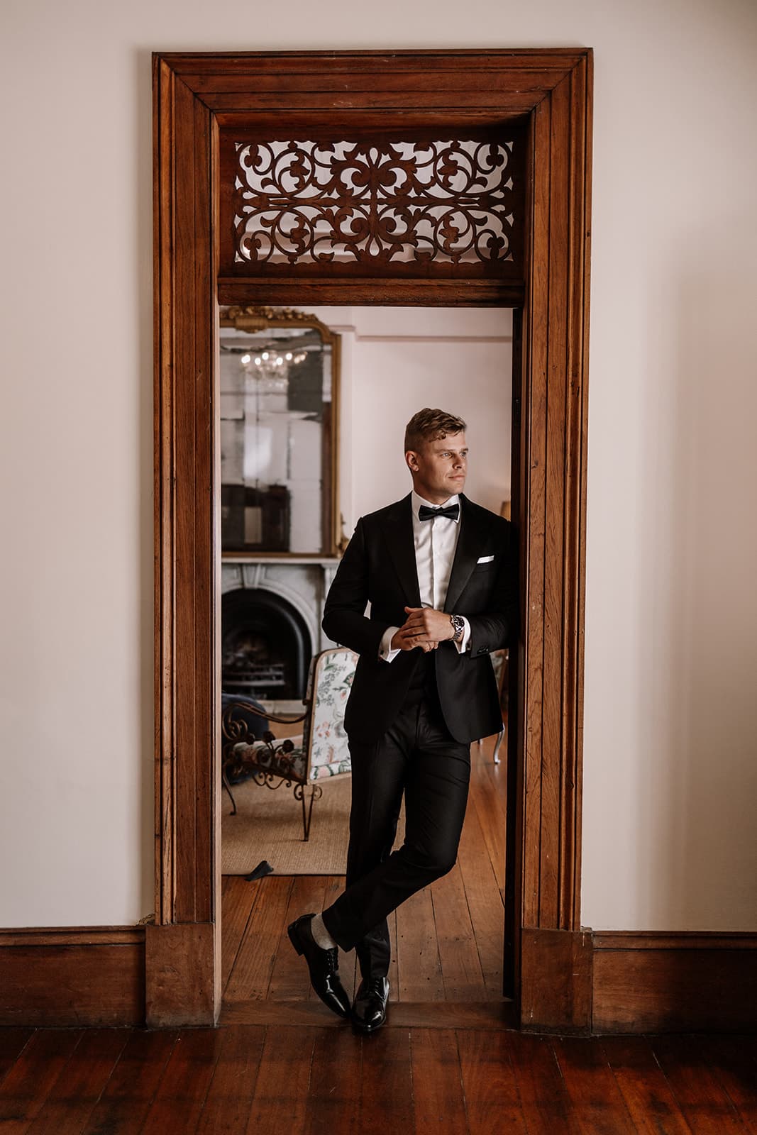 Groom standing in doorway