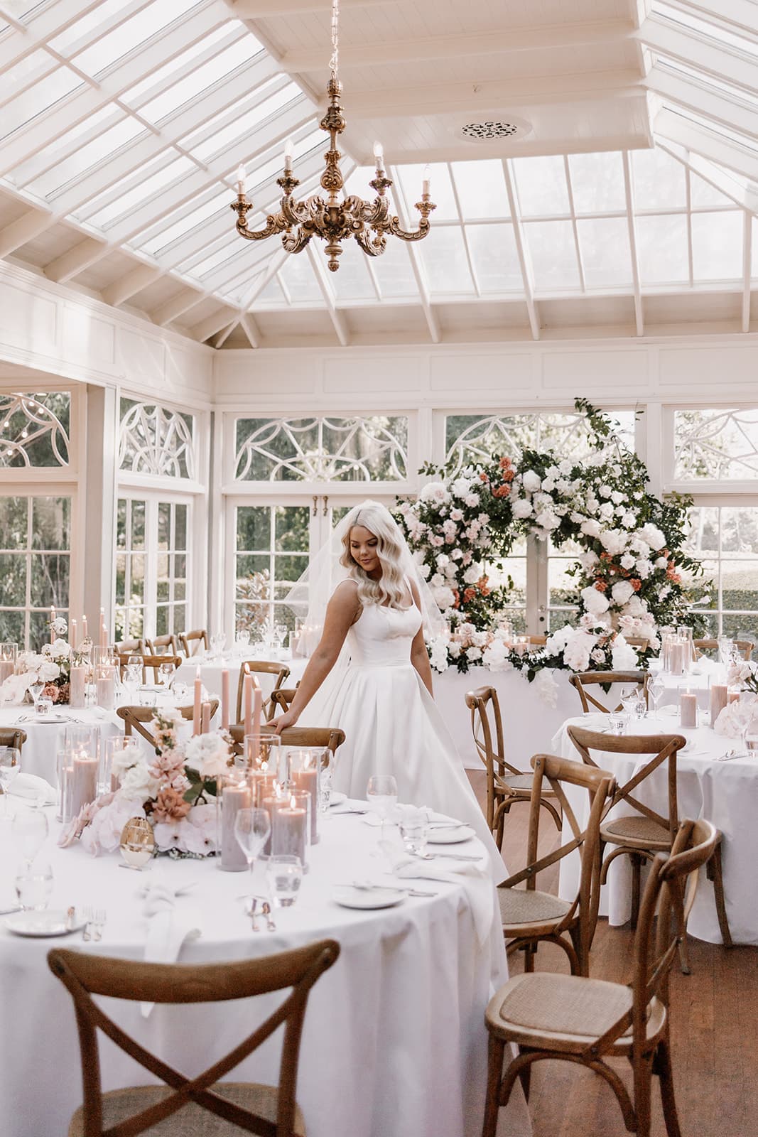 Bride walking through reception room