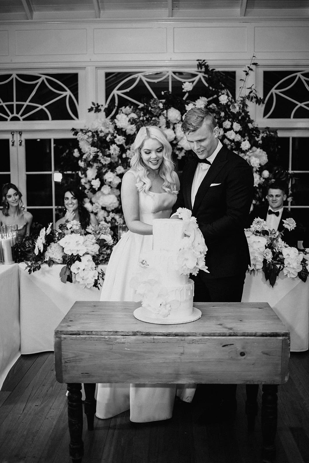 Bride and groom cutting cake